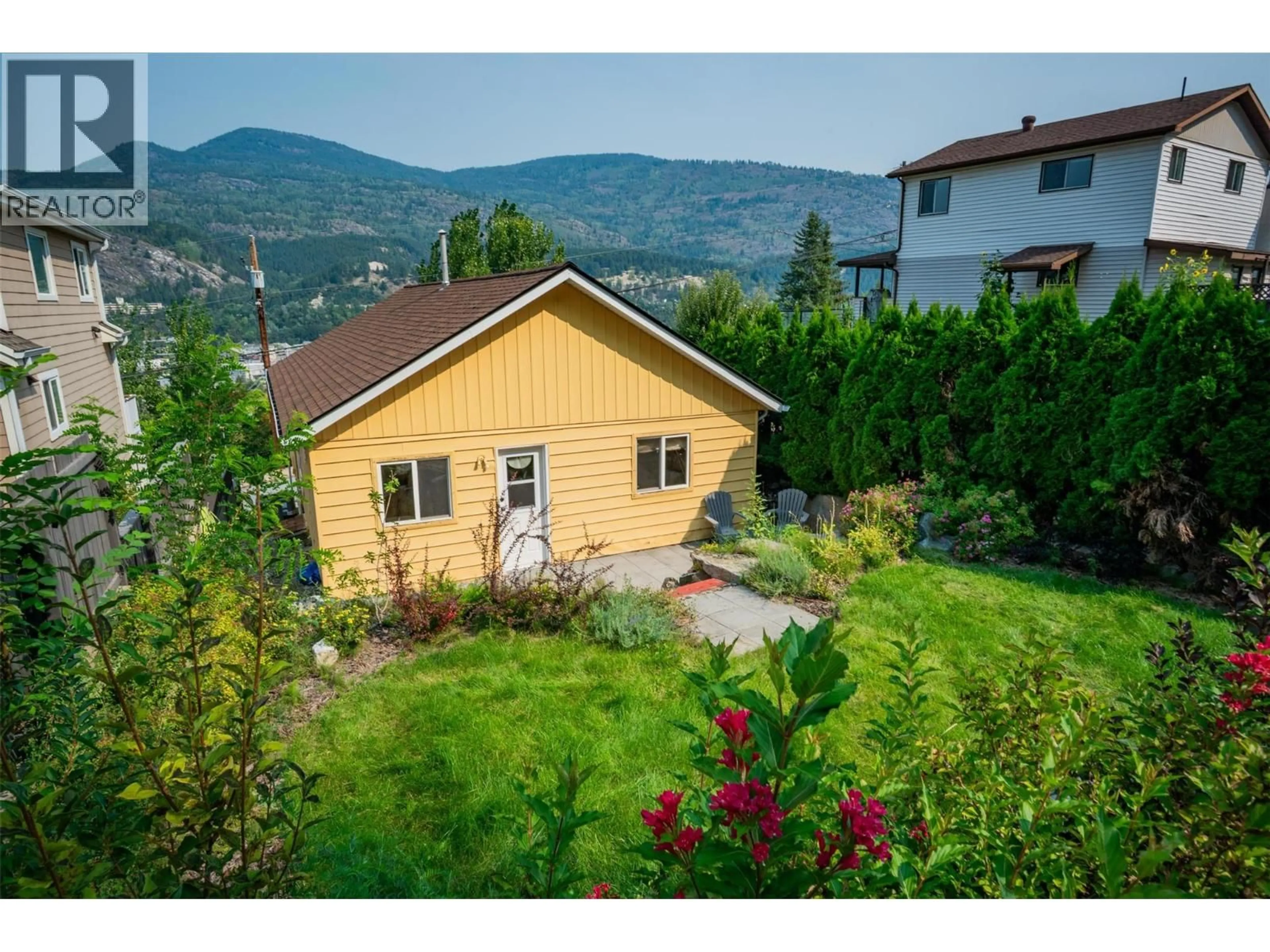 A pic from outside/outdoor area/front of a property/back of a property/a pic from drone, mountain view for 1930 DANIEL STREET, Trail British Columbia V1R4G9