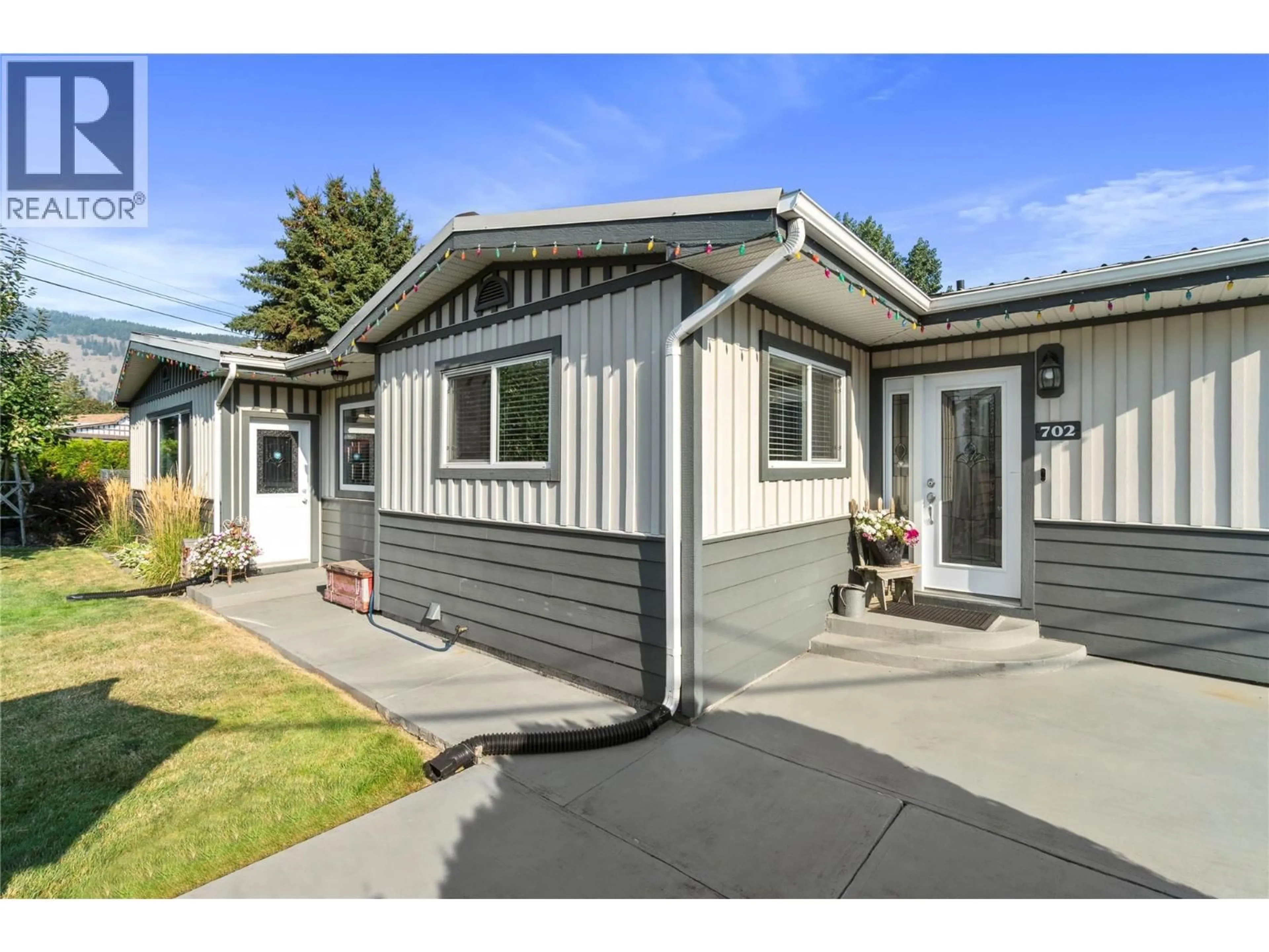 Home with vinyl exterior material, street for 702 SECOND AVENUE, Chase British Columbia V0E1M0