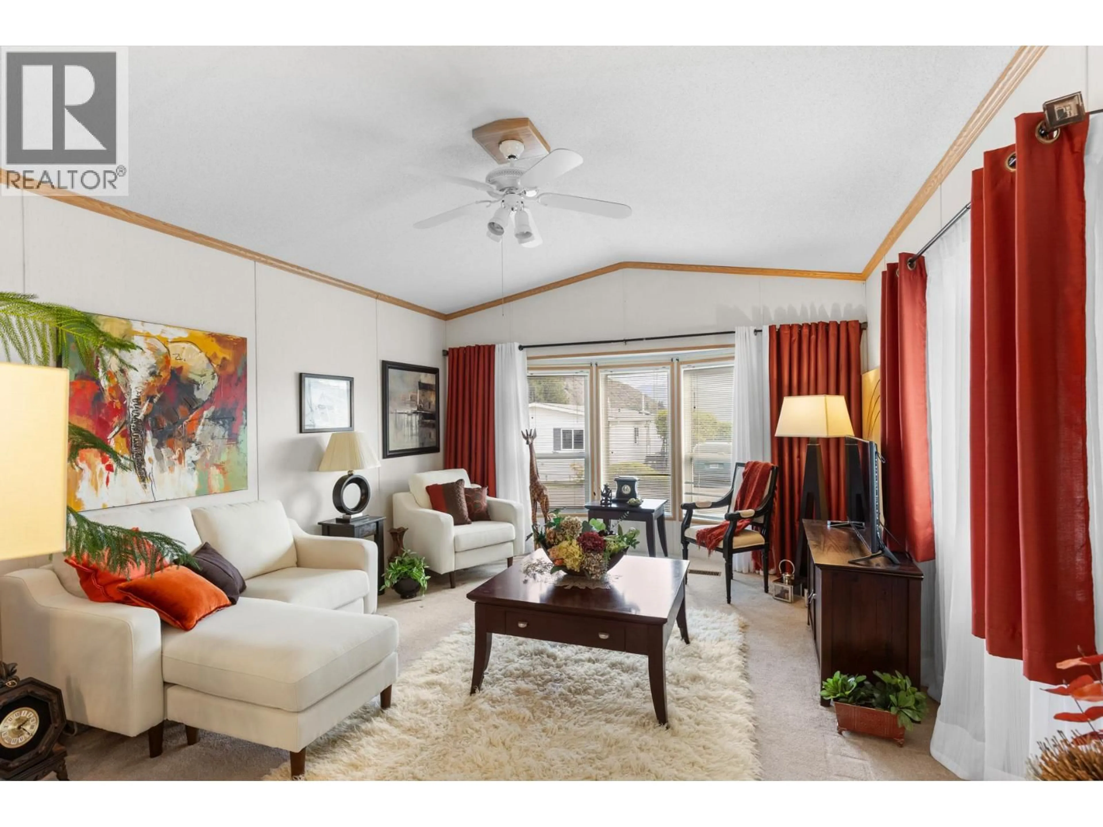 Living room with furniture, wood/laminate floor for 97 - 1850 SHANNON LAKE ROAD, West Kelowna British Columbia V4T1L6