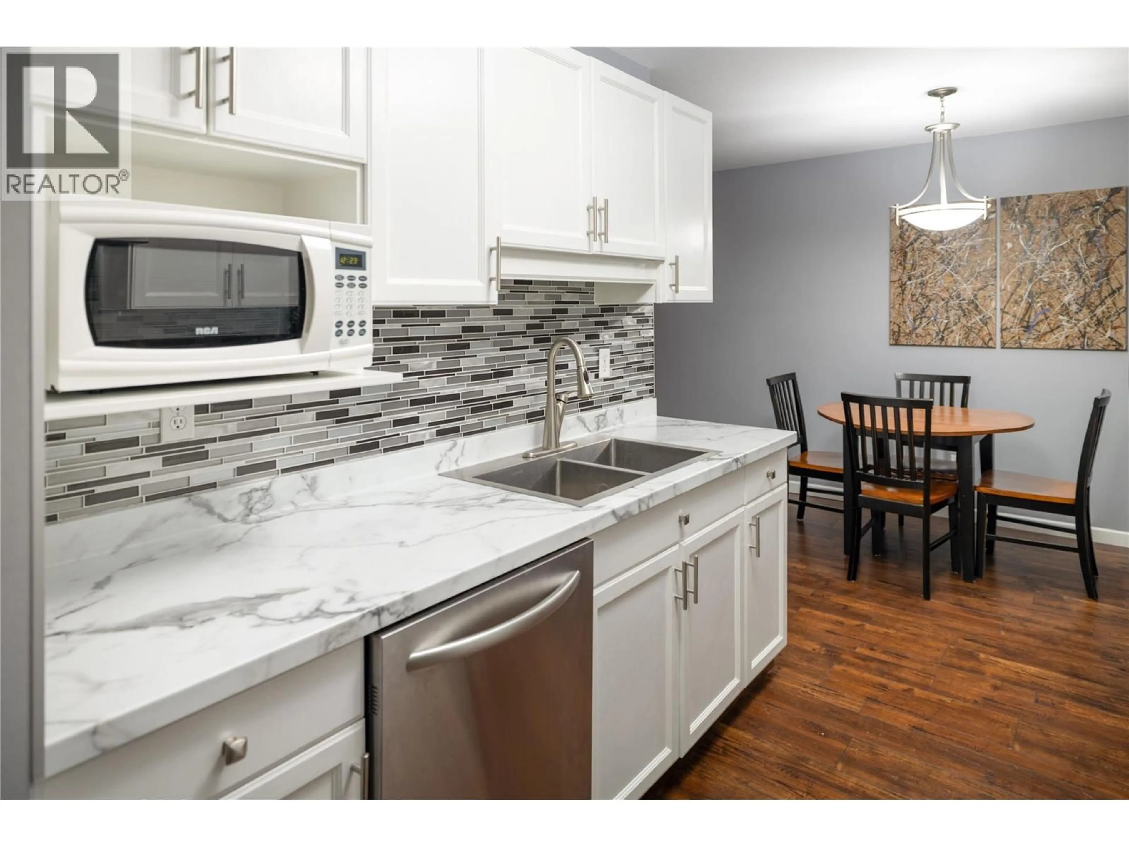 Open concept kitchen, ceramic/tile floor for 404 - 3155 DEMONTREUIL COURT, Kelowna British Columbia V1W3W1