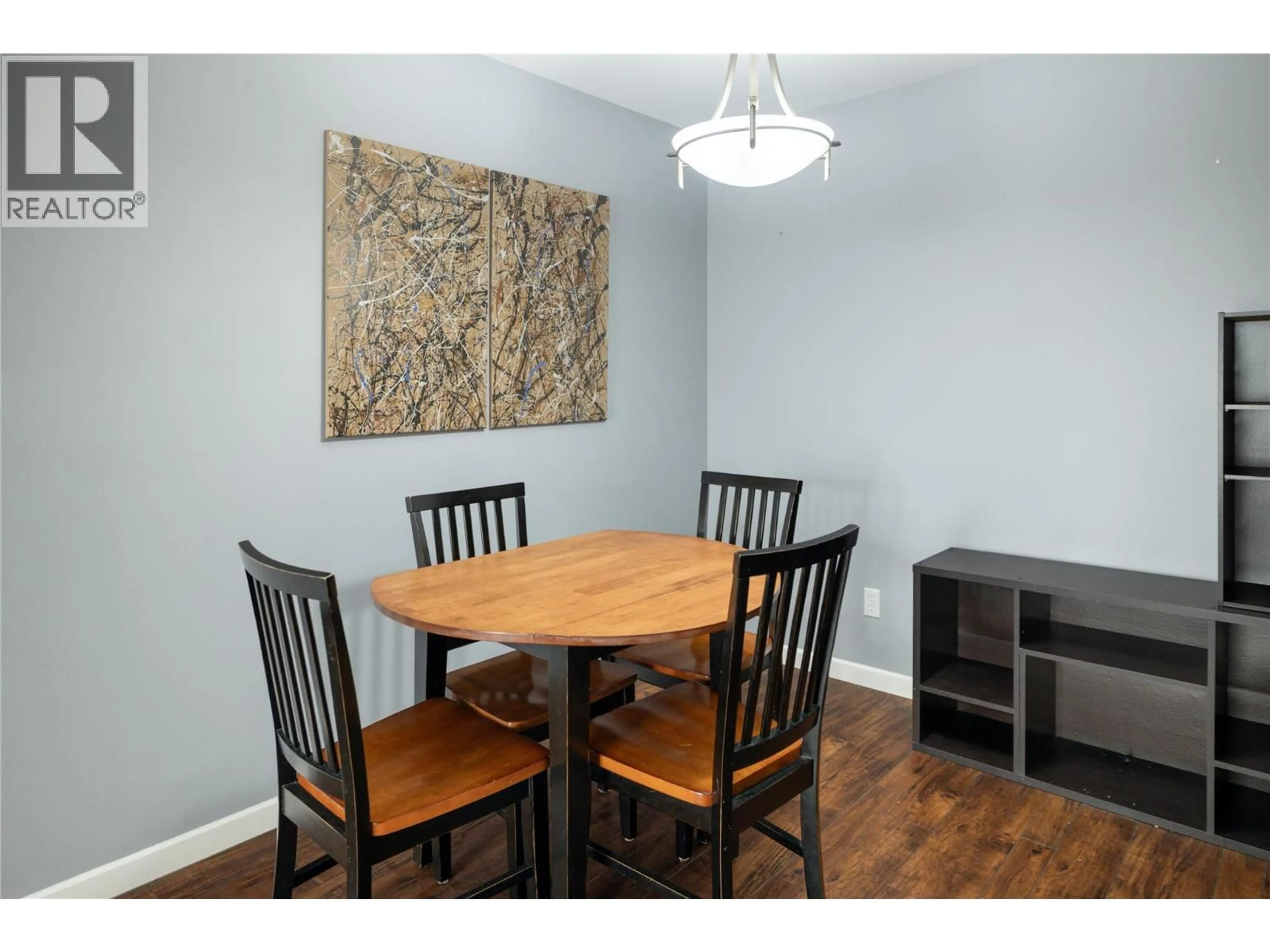Dining room, wood/laminate floor for 404 - 3155 DEMONTREUIL COURT, Kelowna British Columbia V1W3W1