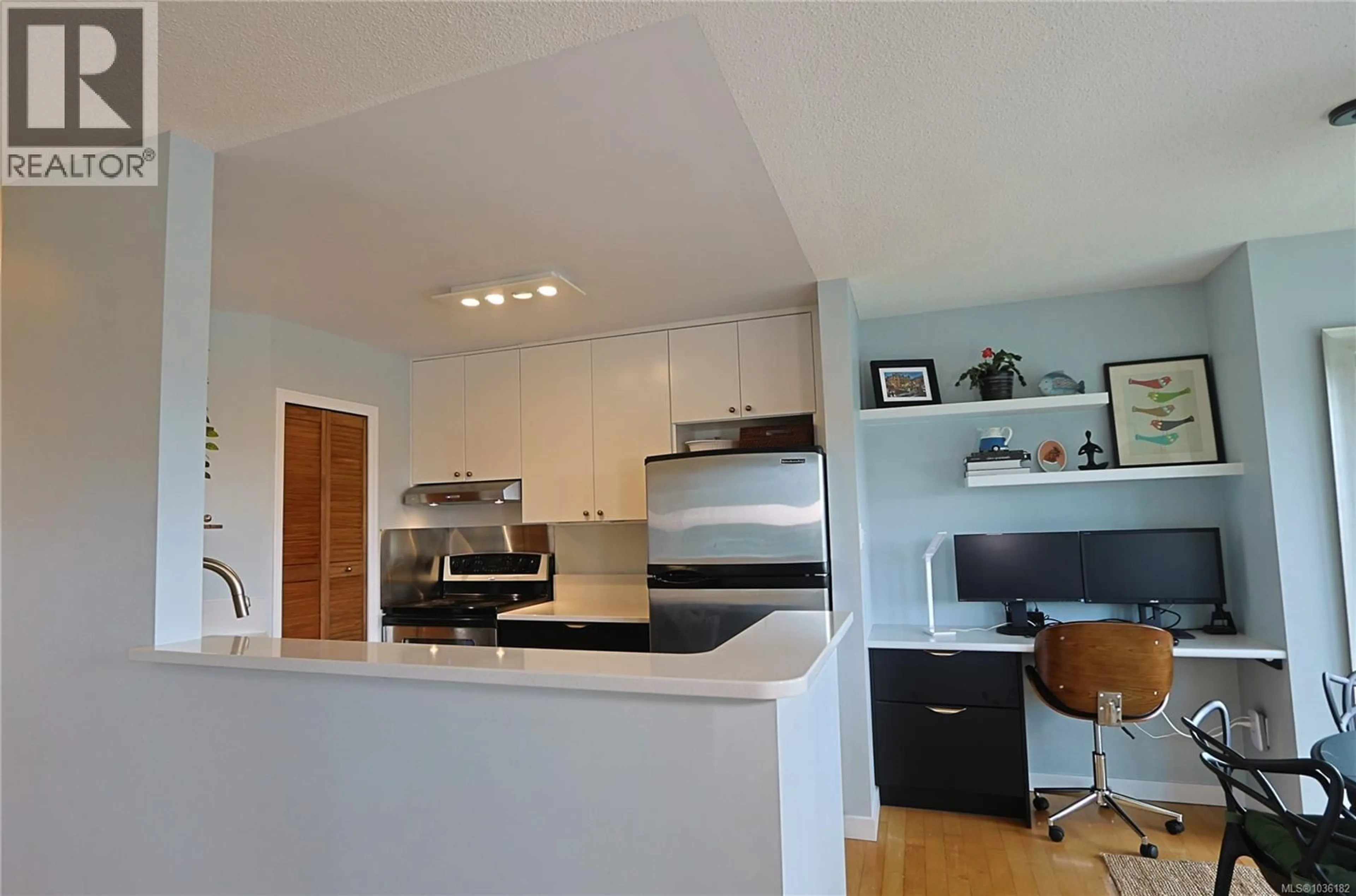 Open concept kitchen, wood/laminate floor for 604 - 4030 QUADRA STREET, Saanich British Columbia V8X1K2
