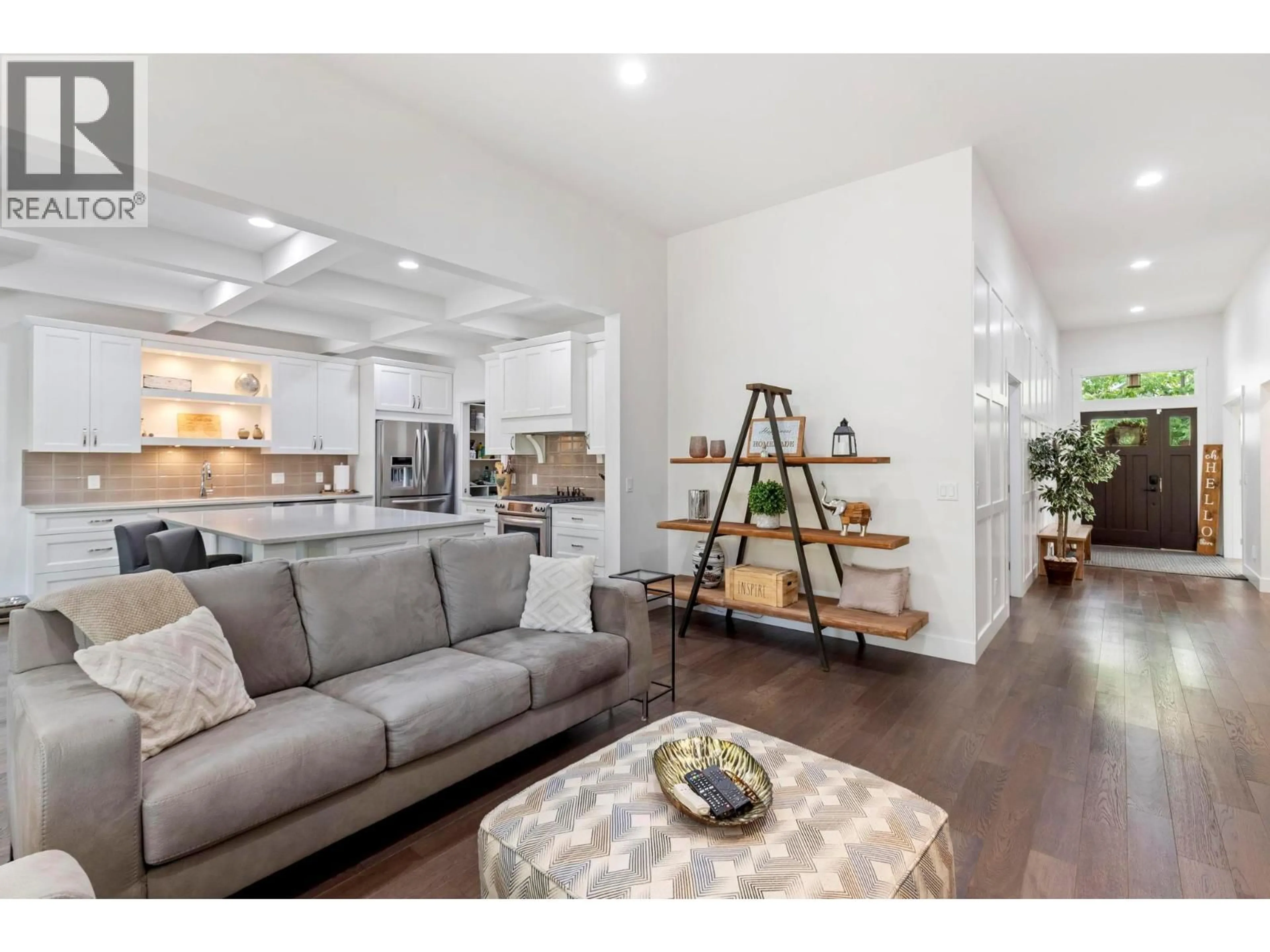 Living room with furniture, wood/laminate floor for 224 LOST CREEK COURT, Kelowna British Columbia V1V3B7