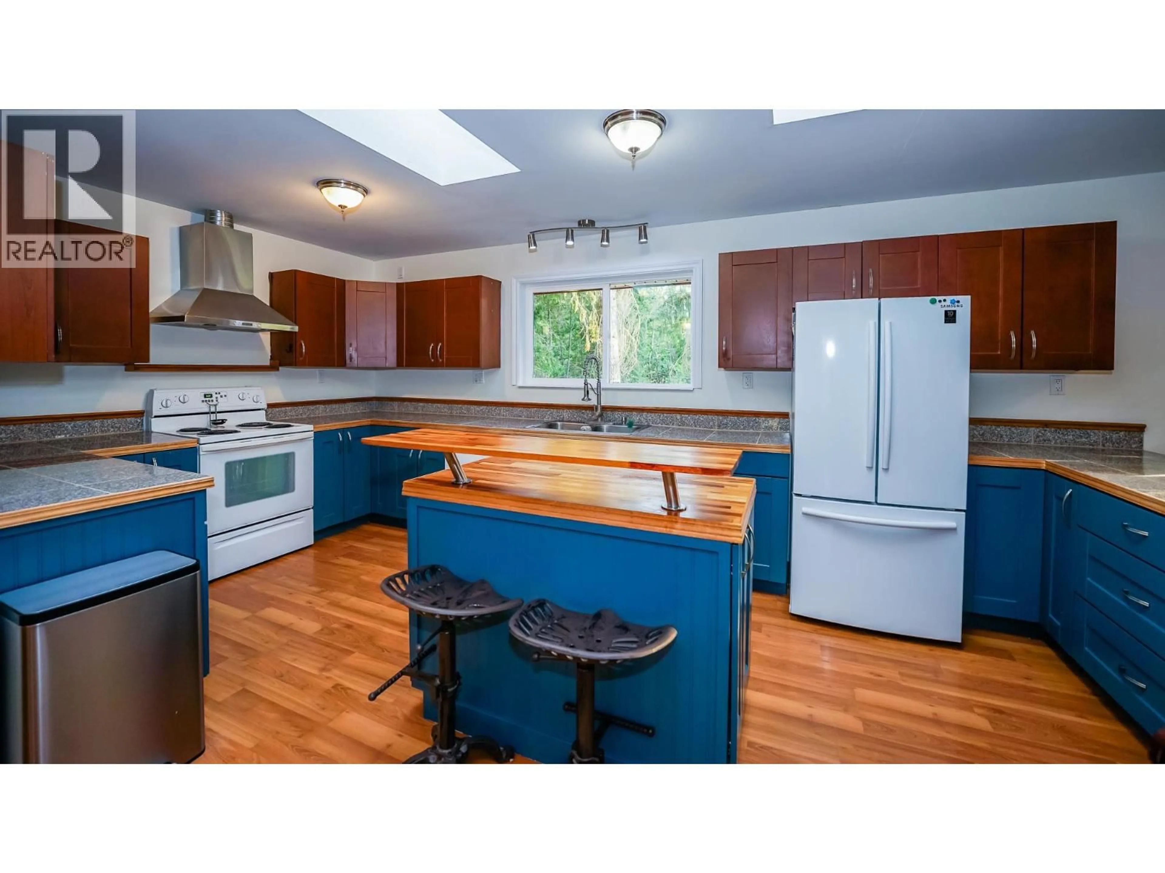 Open concept kitchen, wood/laminate floor for 174 BC-97B OTHER, Enderby British Columbia V4Y4H4