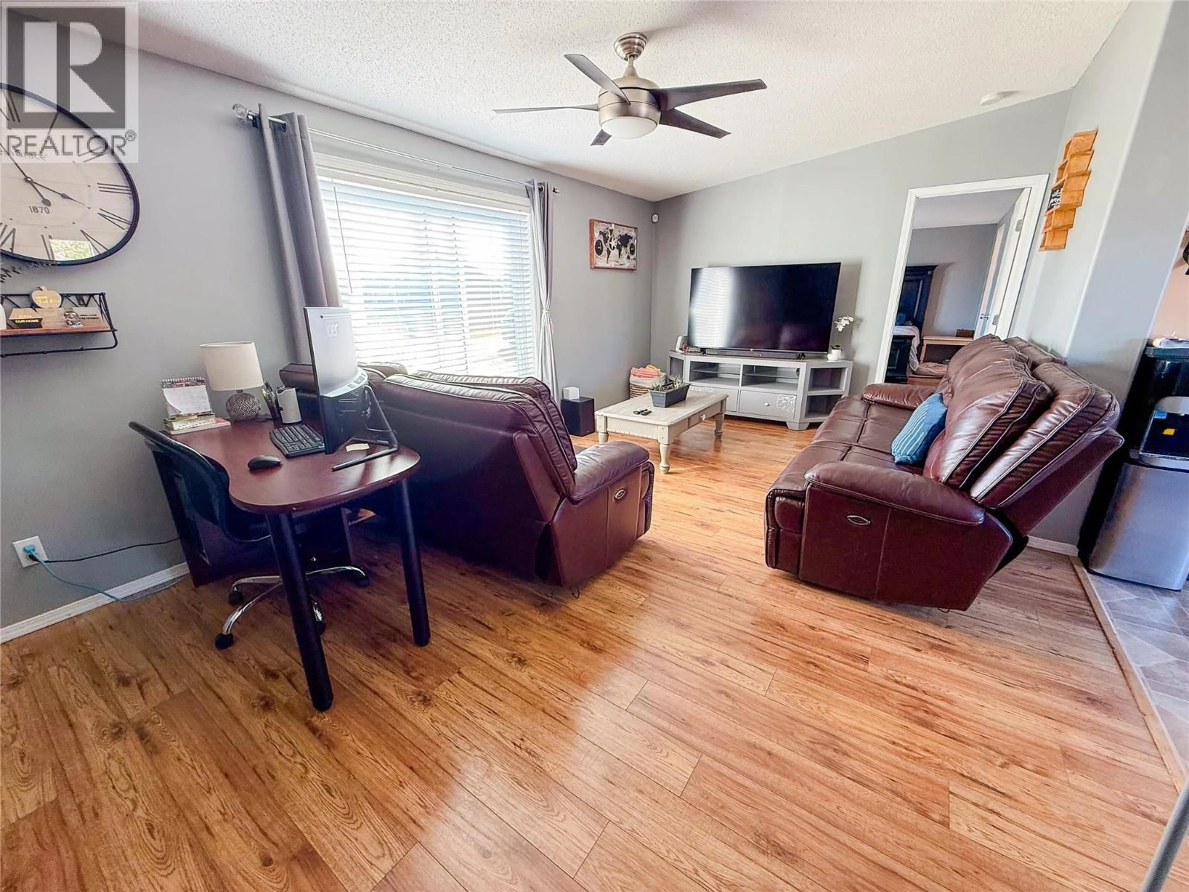 Living room with furniture, wood/laminate floor for 5418 49 STREET, Pouce Coupe British Columbia V0C2C0
