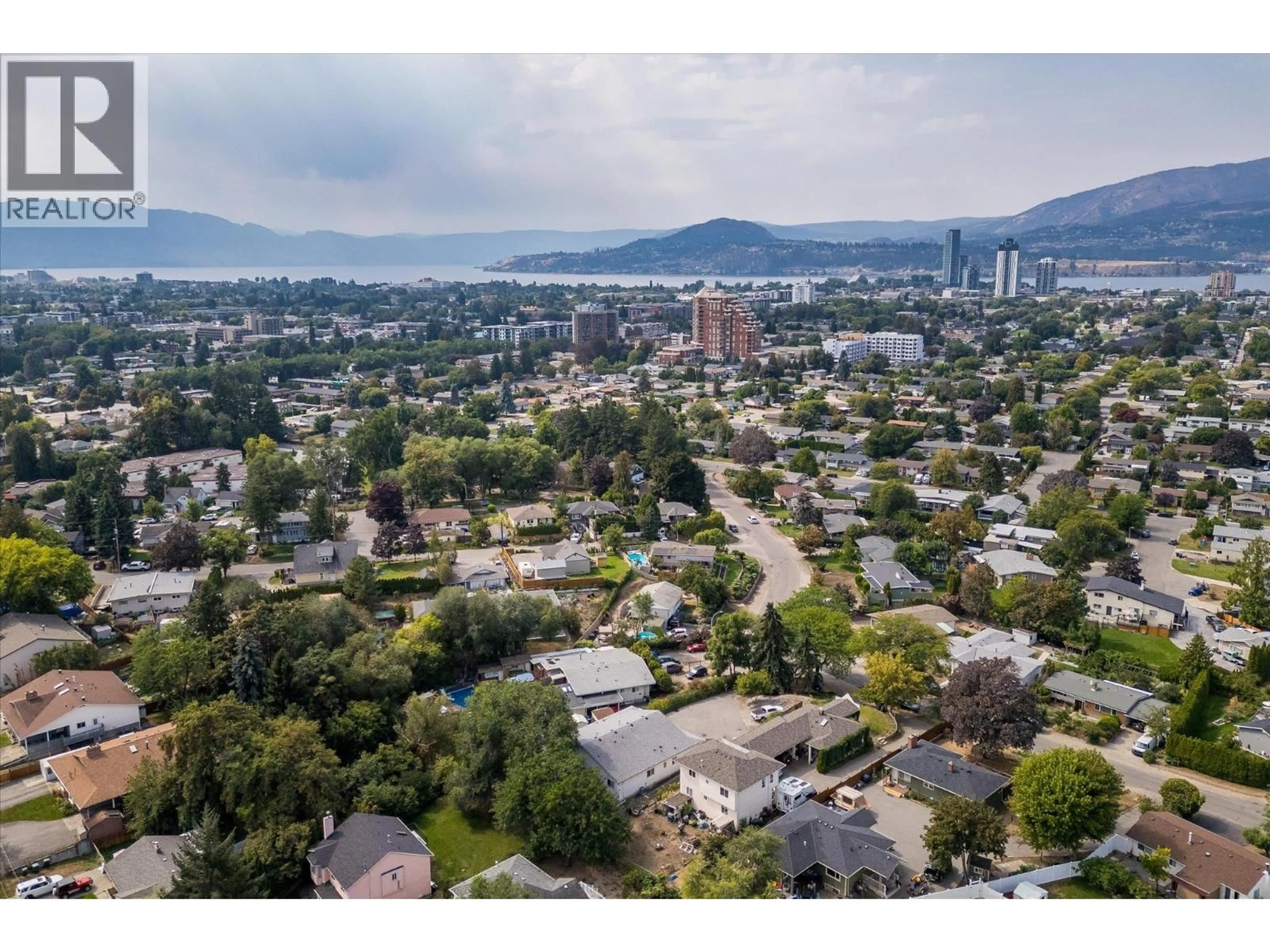 A pic from outside/outdoor area/front of a property/back of a property/a pic from drone, mountain view for 1375/1377 ORCHARD DRIVE, Kelowna British Columbia V1Y3V1