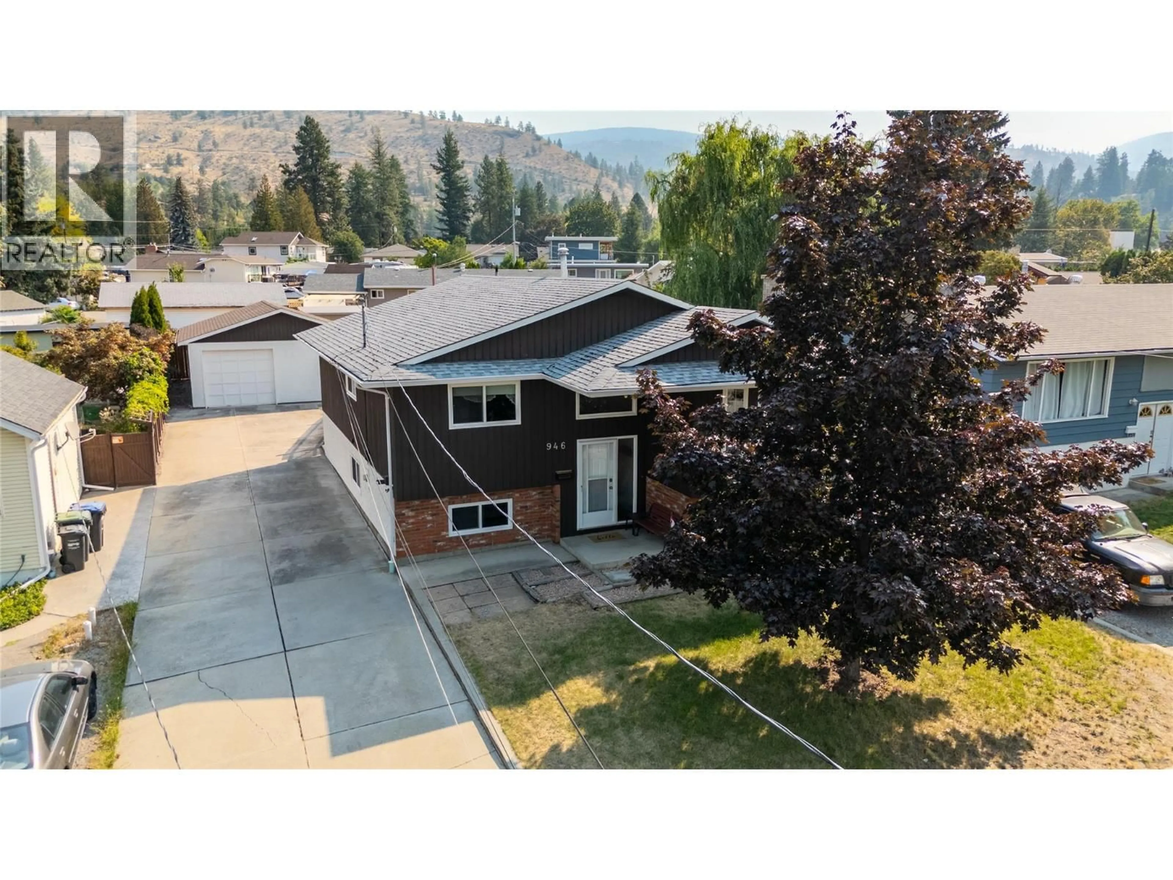 A pic from outside/outdoor area/front of a property/back of a property/a pic from drone, mountain view for 946 JAMES STREET, Penticton British Columbia V2A4A7