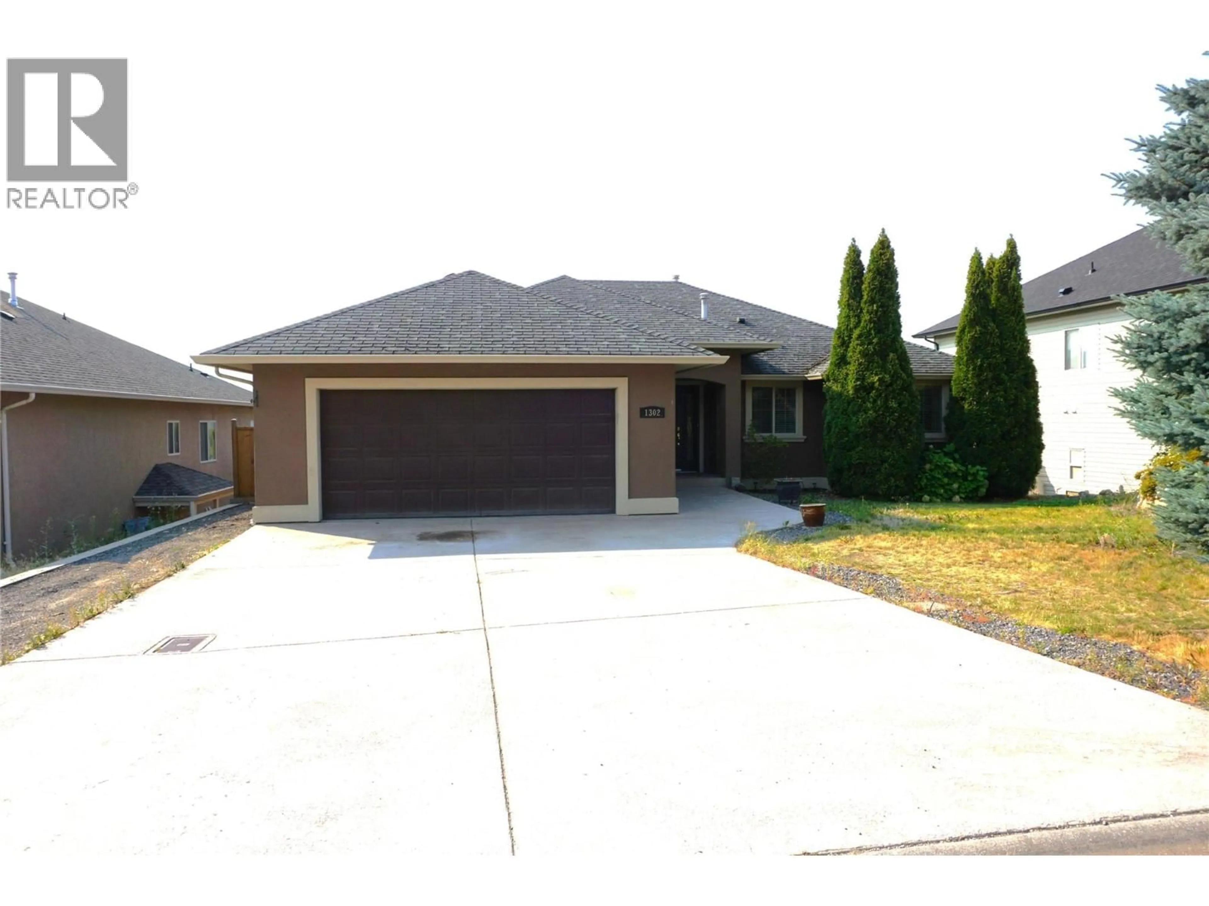 Home with brick exterior material, street for 1302 LOSETH DRIVE, Kelowna British Columbia V1P1N2