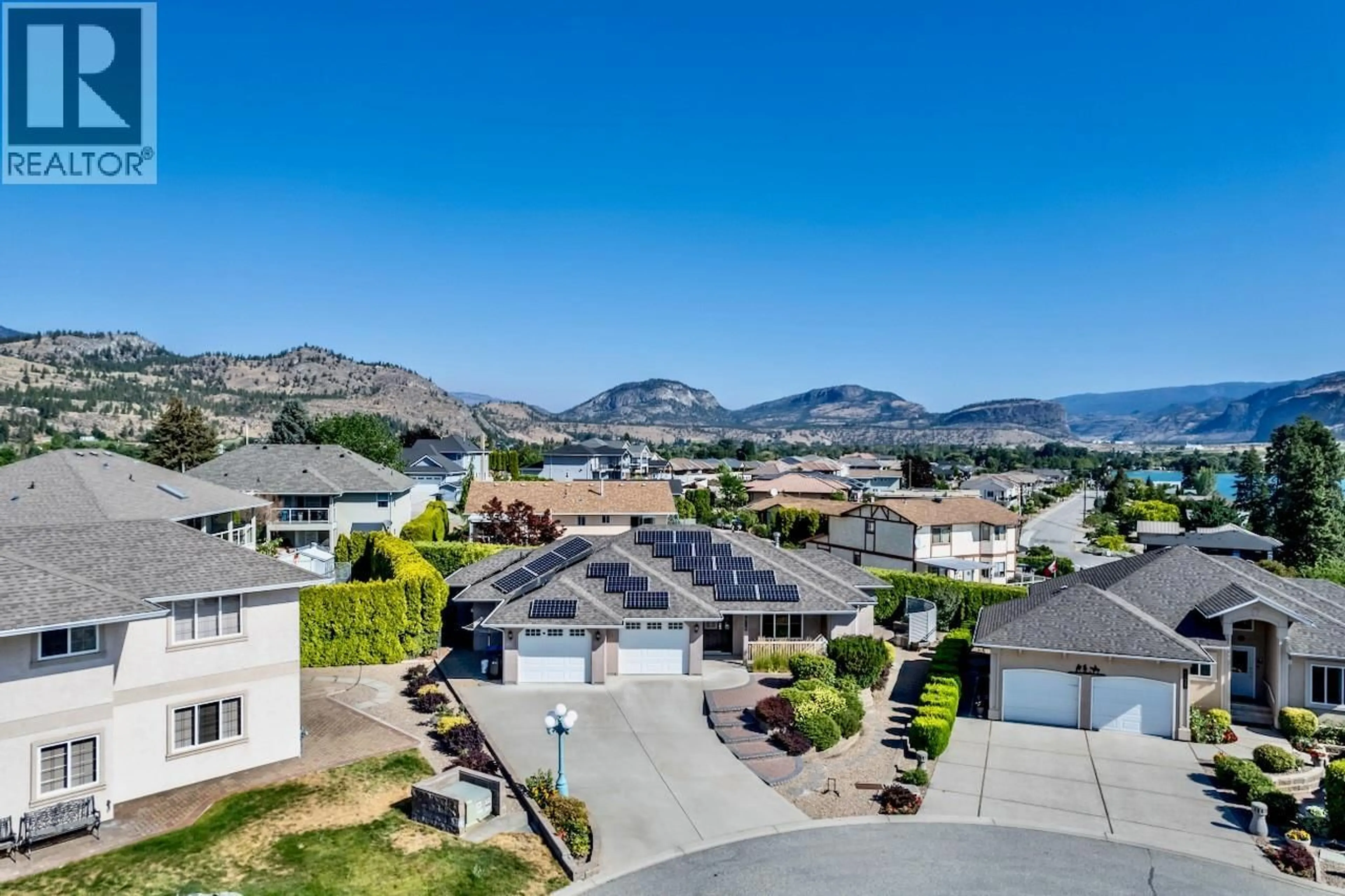 A pic from outside/outdoor area/front of a property/back of a property/a pic from drone, mountain view for 6718 MERLOT COURT, Oliver British Columbia V0H1T4