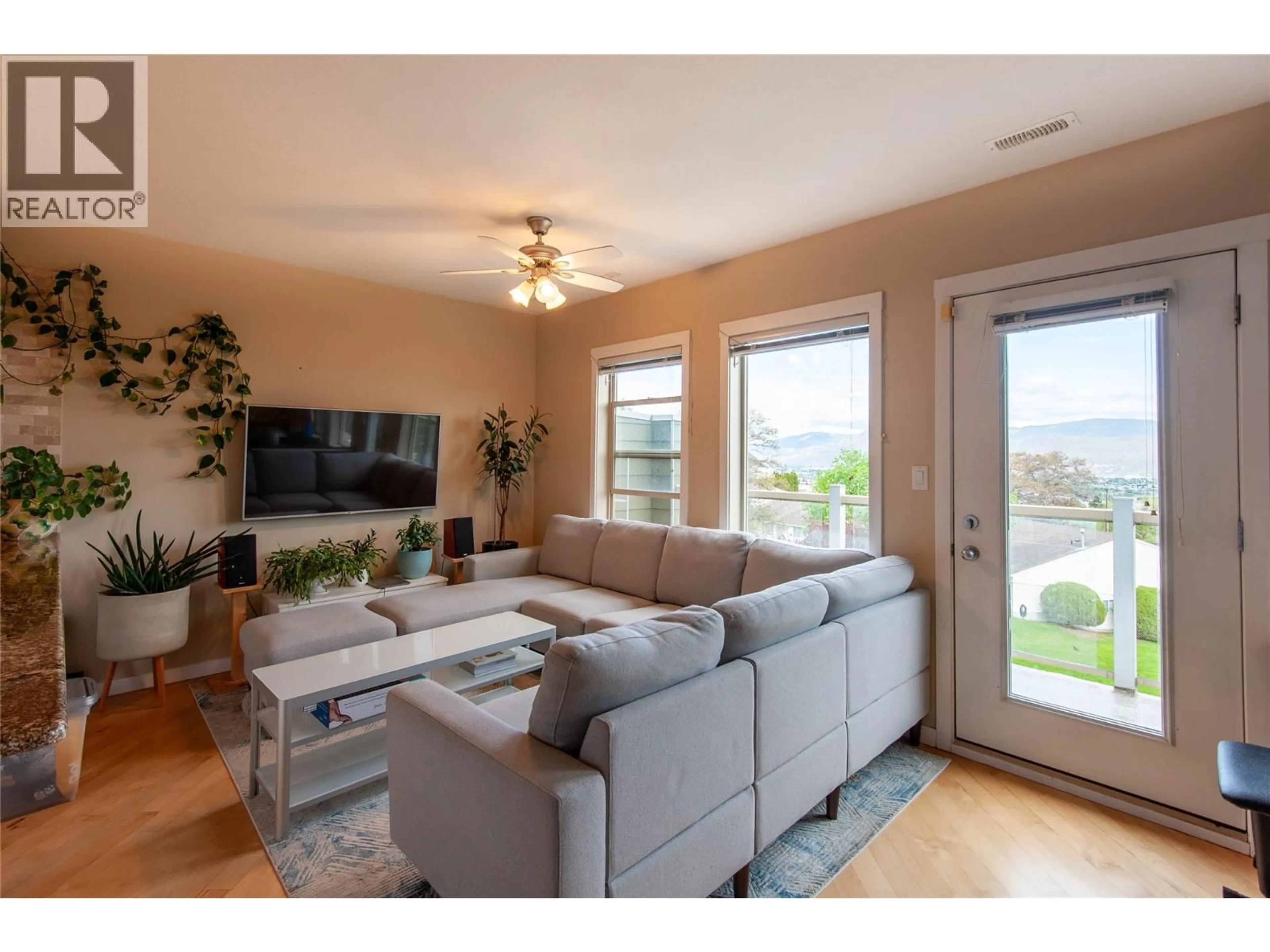 Living room with furniture, wood/laminate floor for 10 - 445 DALGLEISH DRIVE, Kamloops British Columbia V2C6C7