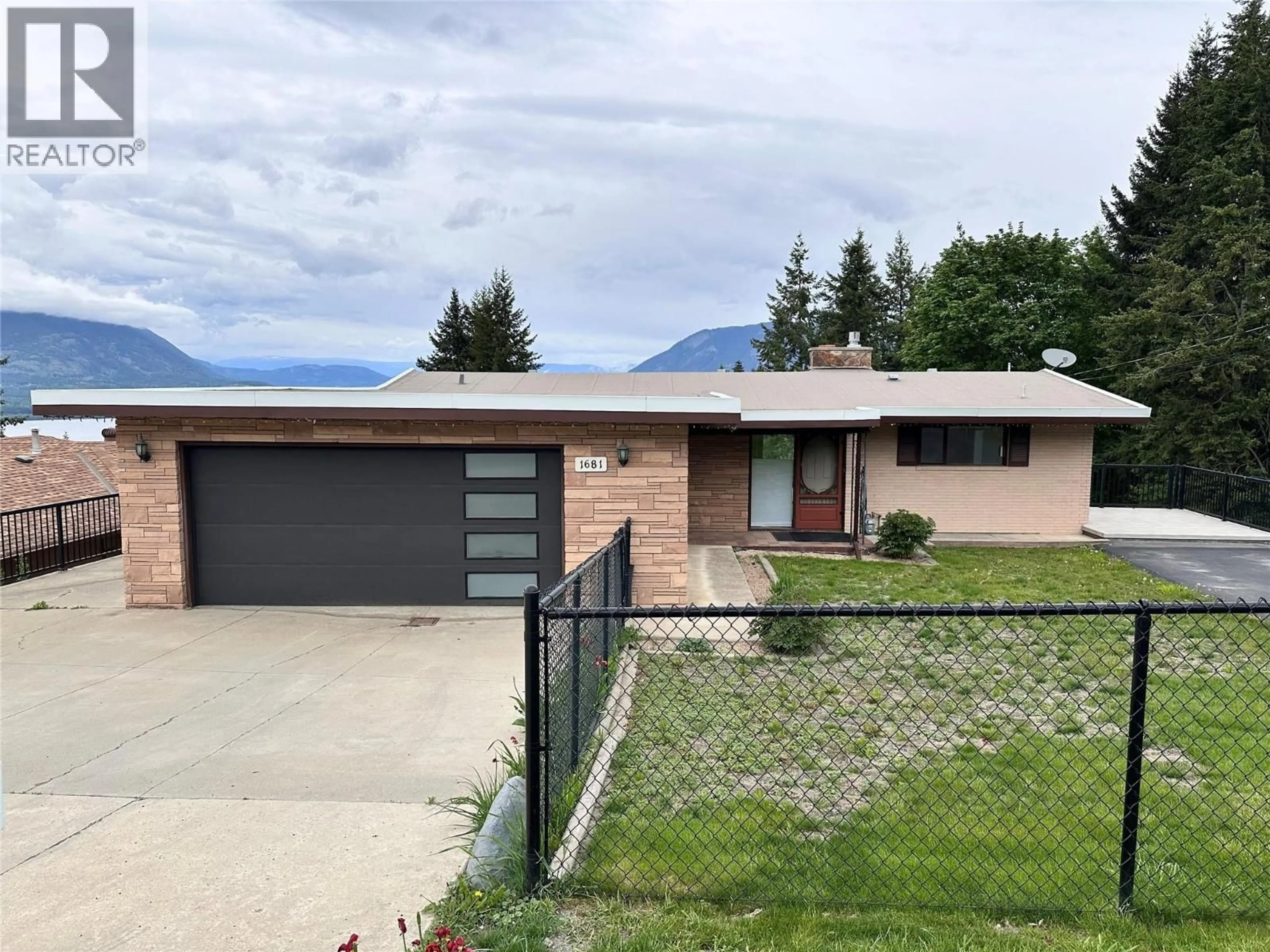 A pic from outside/outdoor area/front of a property/back of a property/a pic from drone, mountain view for 1681 12 AVENUE SOUTHEAST, Salmon Arm British Columbia V1E2E4