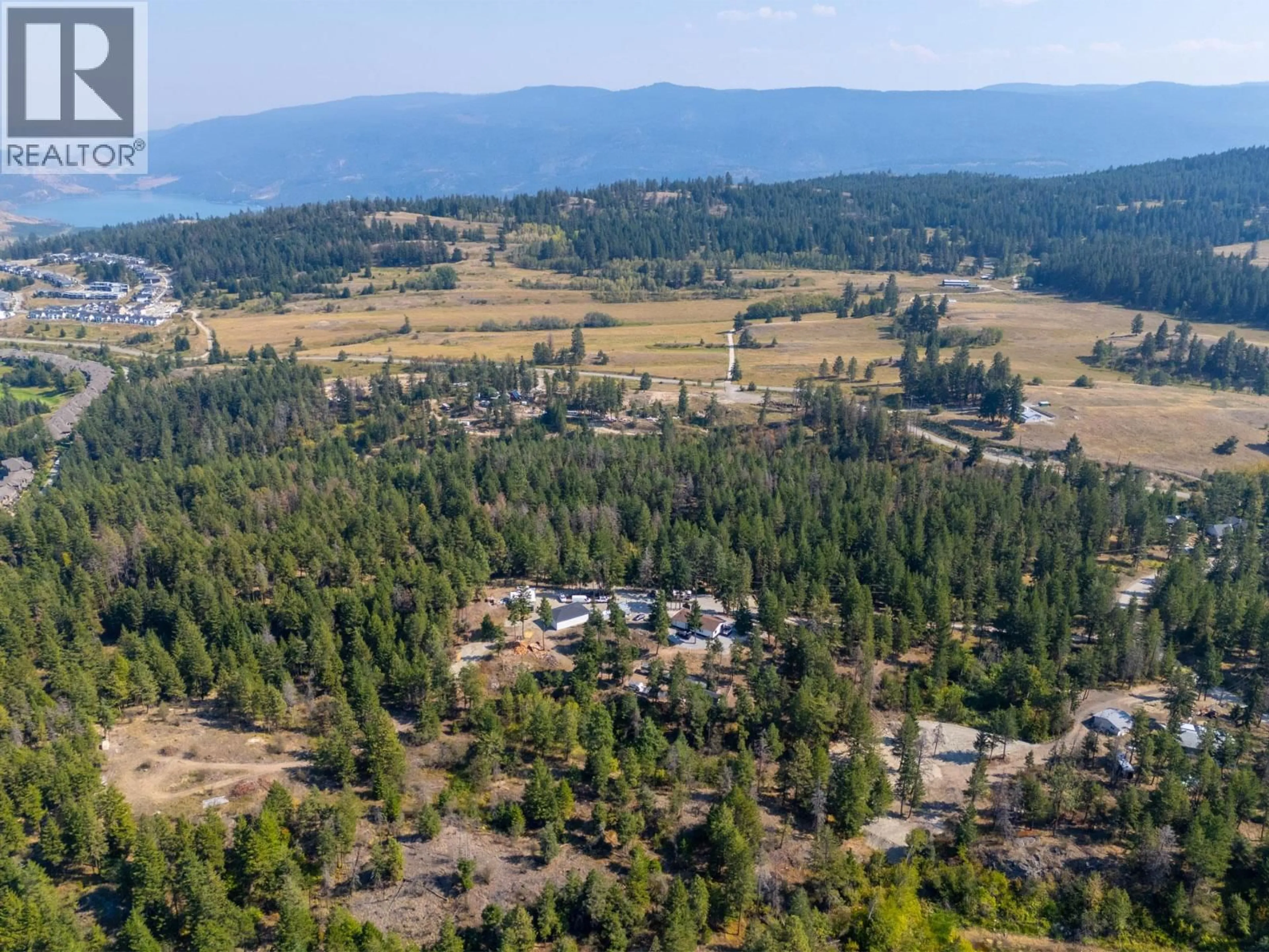 A pic from outside/outdoor area/front of a property/back of a property/a pic from drone, mountain view for 338 HOWARDS ROAD, Vernon British Columbia V1T6Y5