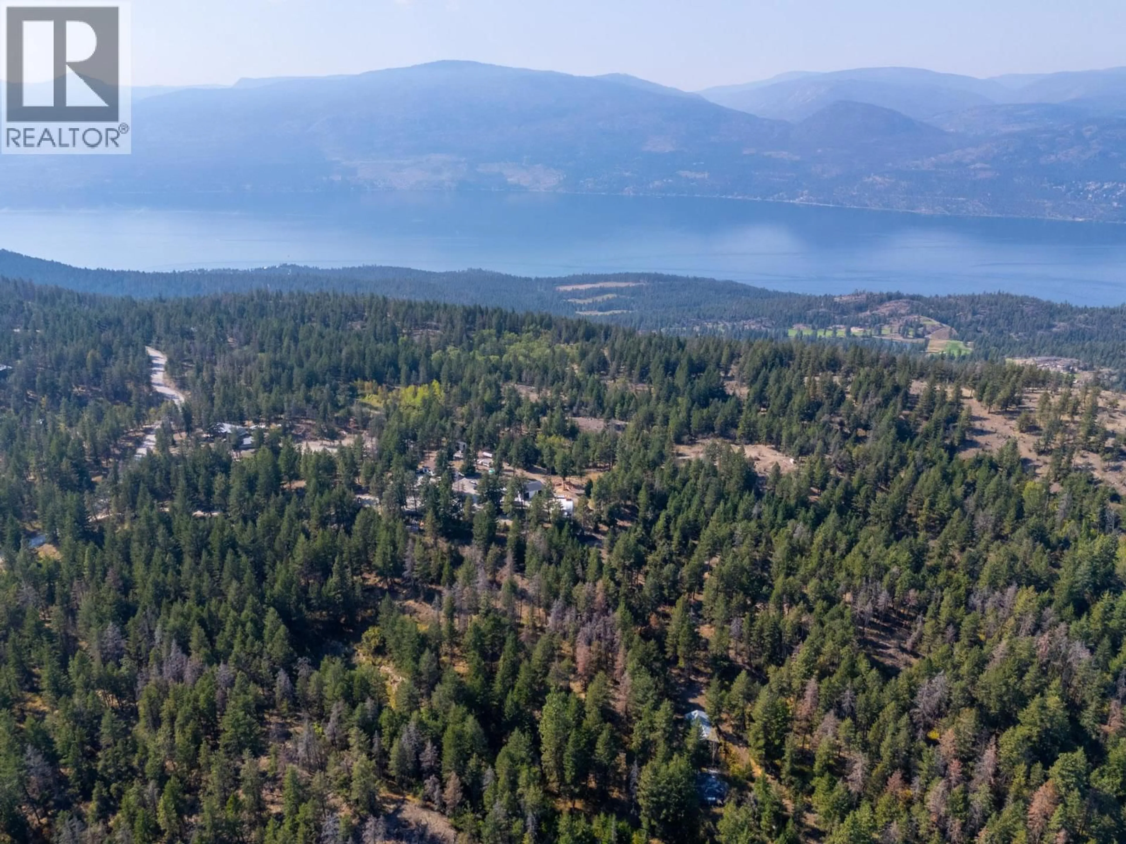 A pic from outside/outdoor area/front of a property/back of a property/a pic from drone, forest/trees view for 338 HOWARDS ROAD, Vernon British Columbia V1T6Y5