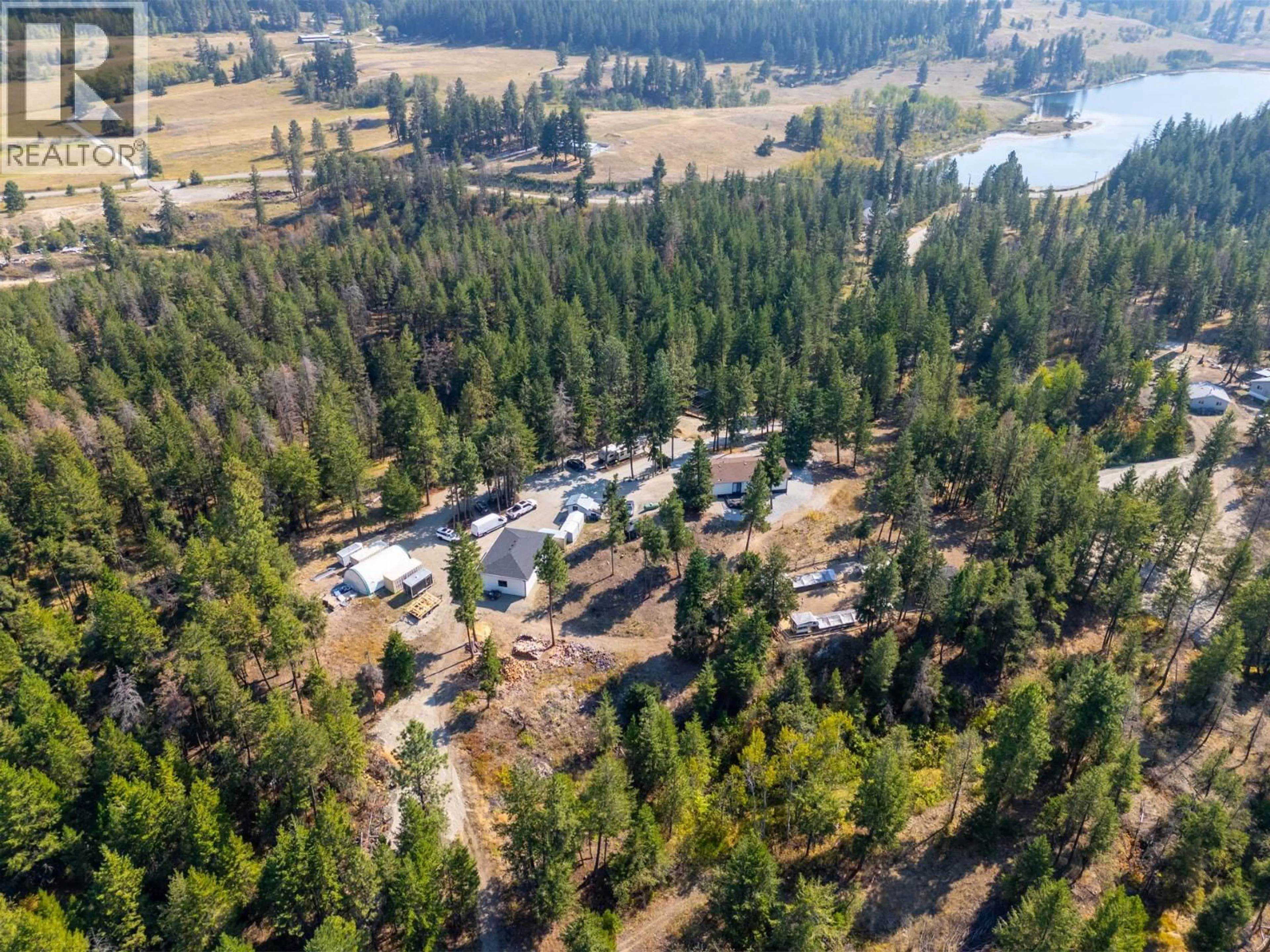 A pic from outside/outdoor area/front of a property/back of a property/a pic from drone, forest/trees view for 338 HOWARDS ROAD, Vernon British Columbia V1T6Y5