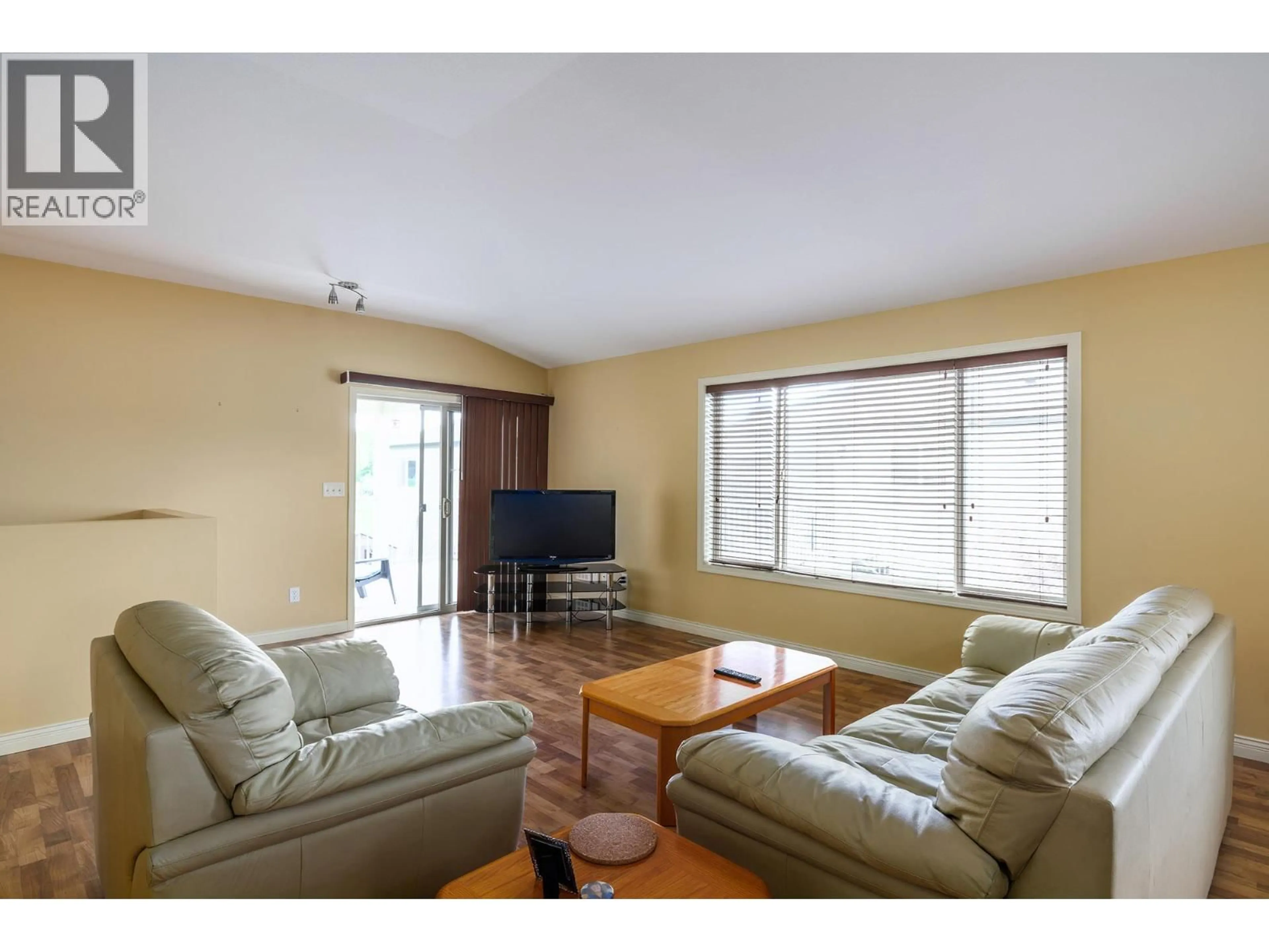 Living room with furniture, wood/laminate floor for 13 - 11392 LODGE ROAD, Lake Country British Columbia V4V1X2