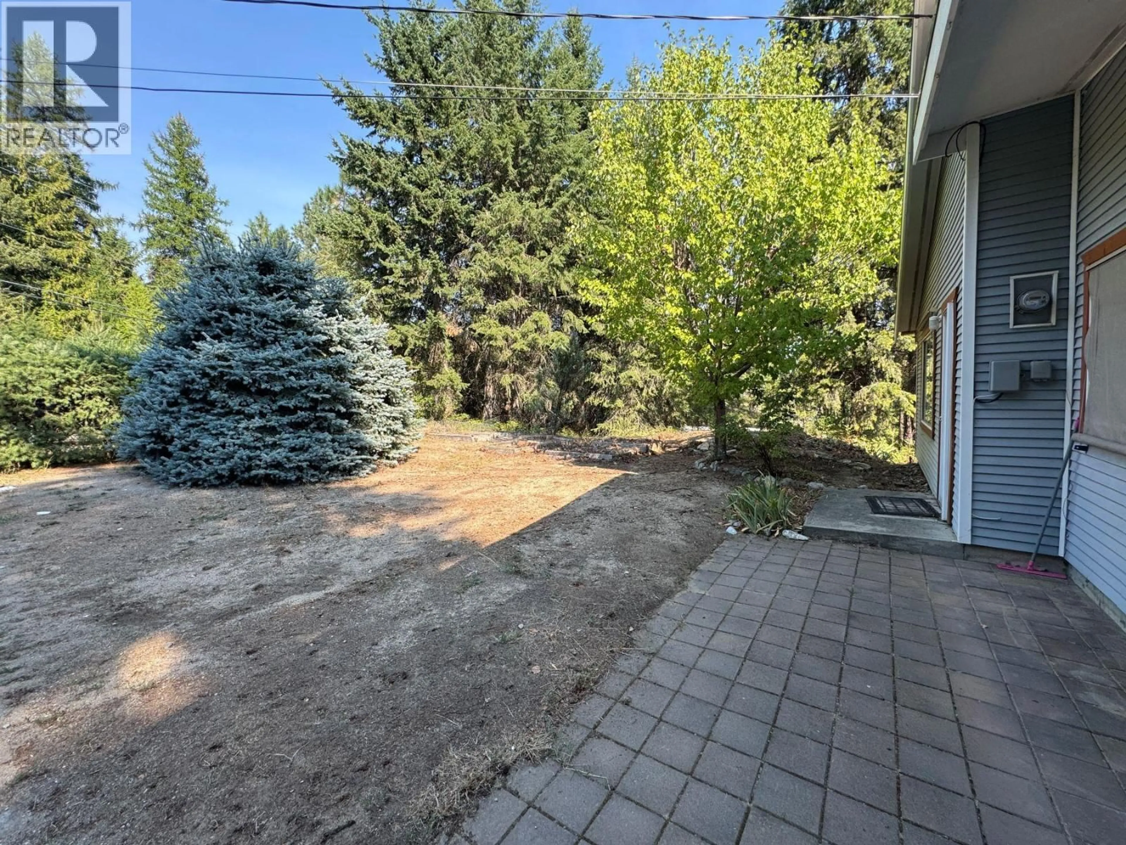 Patio, forest/trees view for 102 CHASE ROAD, Christina Lake British Columbia V0H1E0