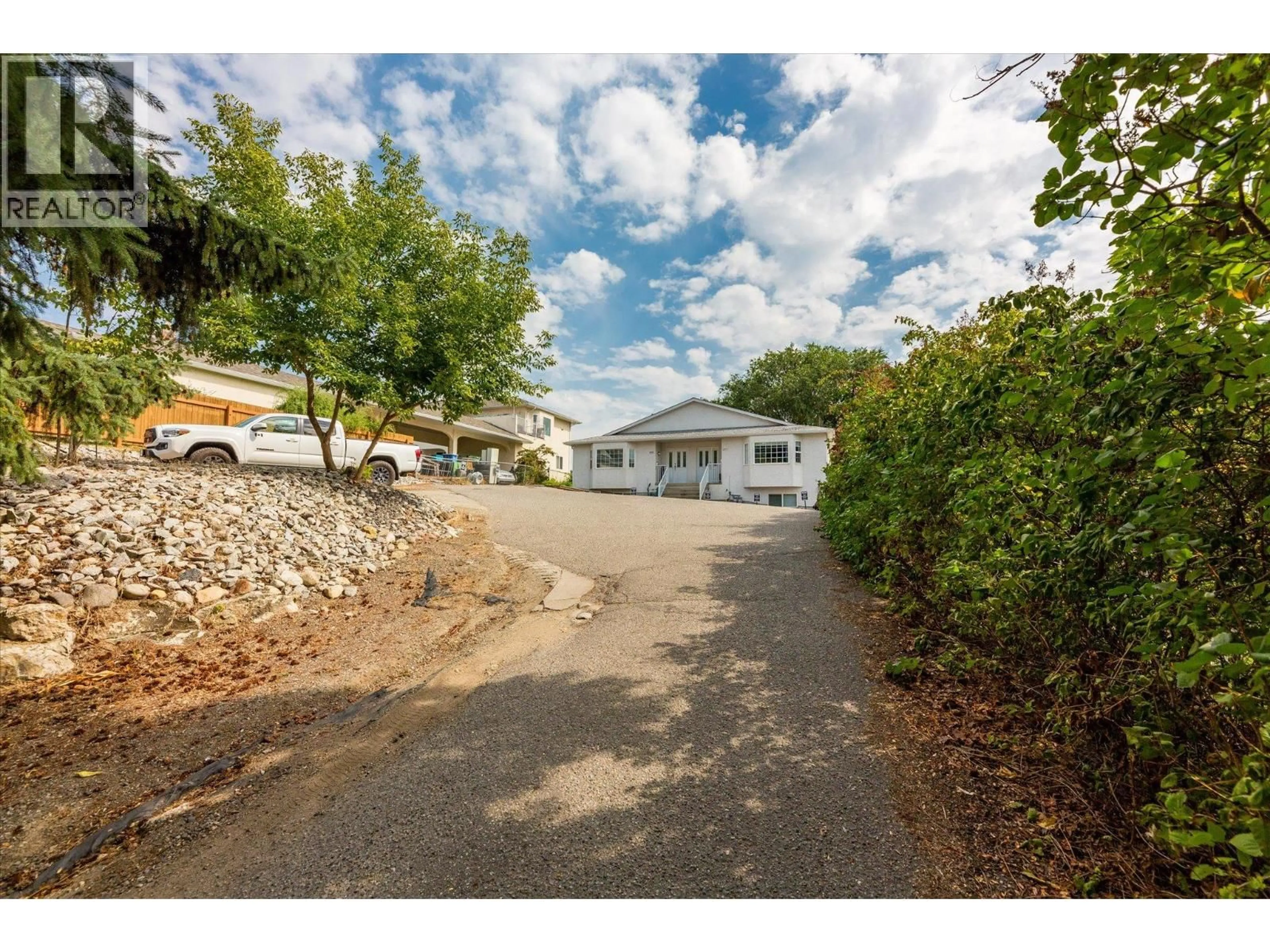 A pic from outside/outdoor area/front of a property/back of a property/a pic from drone, street for 1377 ORCHARD DRIVE, Kelowna British Columbia V1Y3V1