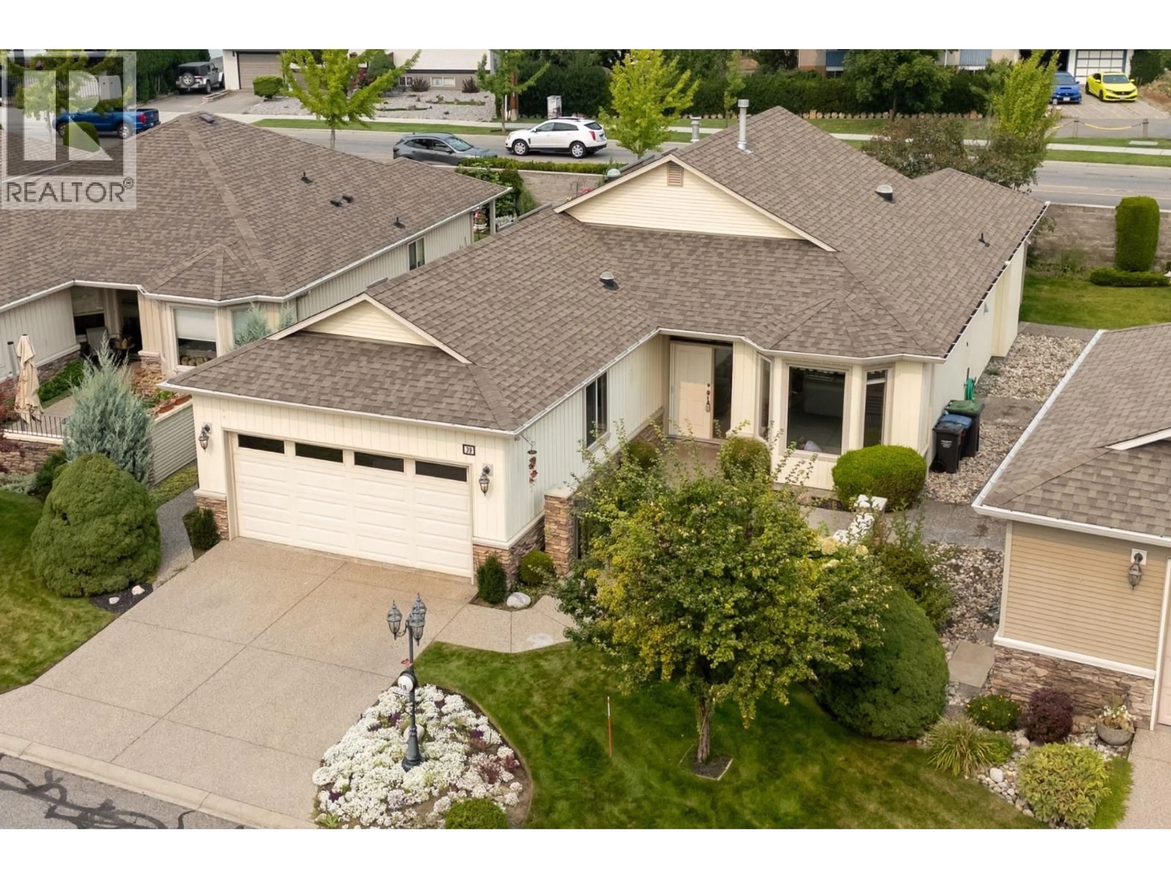A pic from outside/outdoor area/front of a property/back of a property/a pic from drone, street for 39 2365 STILLINGLEET ROAD, Kelowna British Columbia V1W4X5