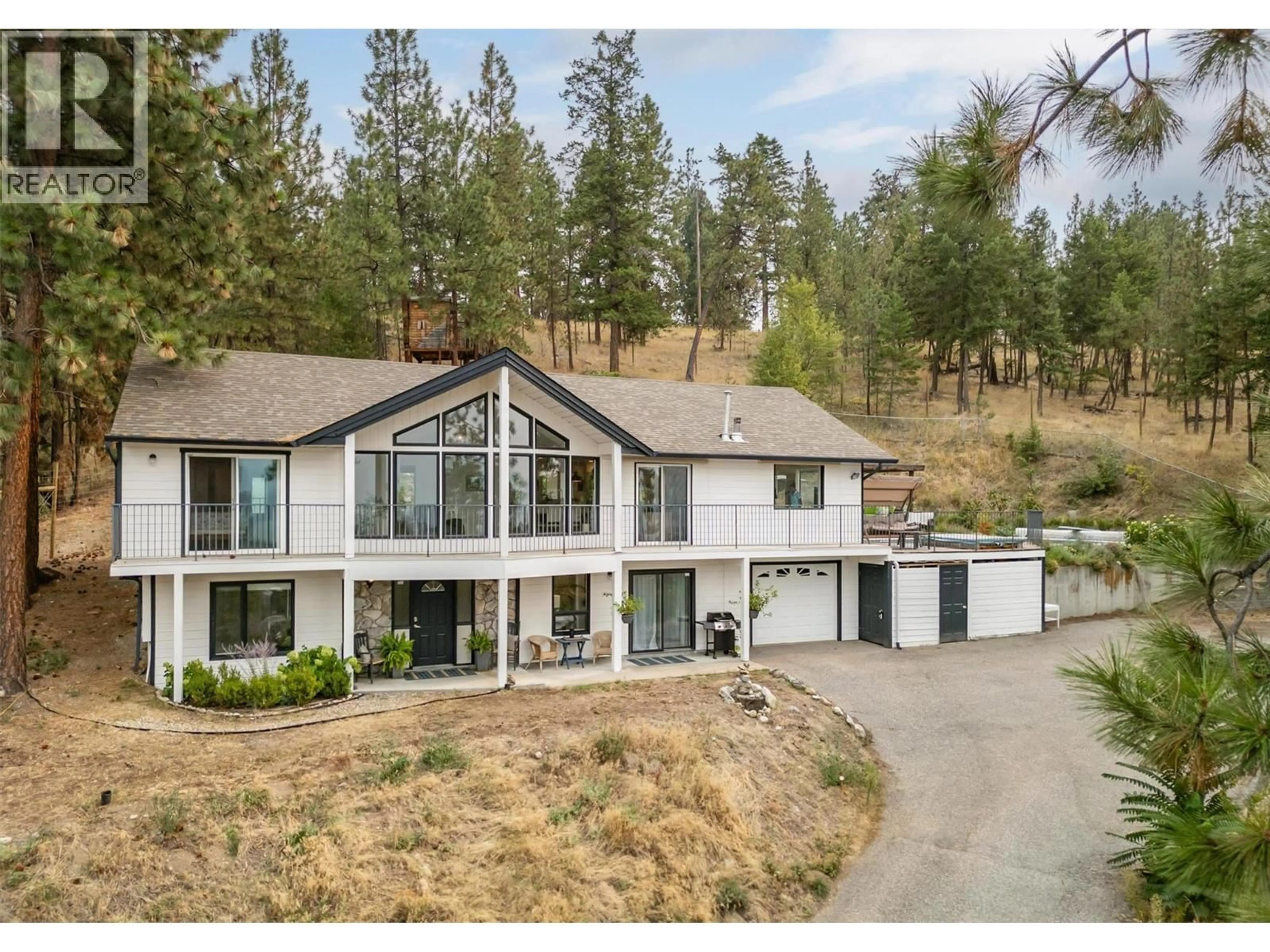 A pic from outside/outdoor area/front of a property/back of a property/a pic from drone, mountain view for 965 BARTHOLOMEW COURT, Kelowna British Columbia V1W4N2