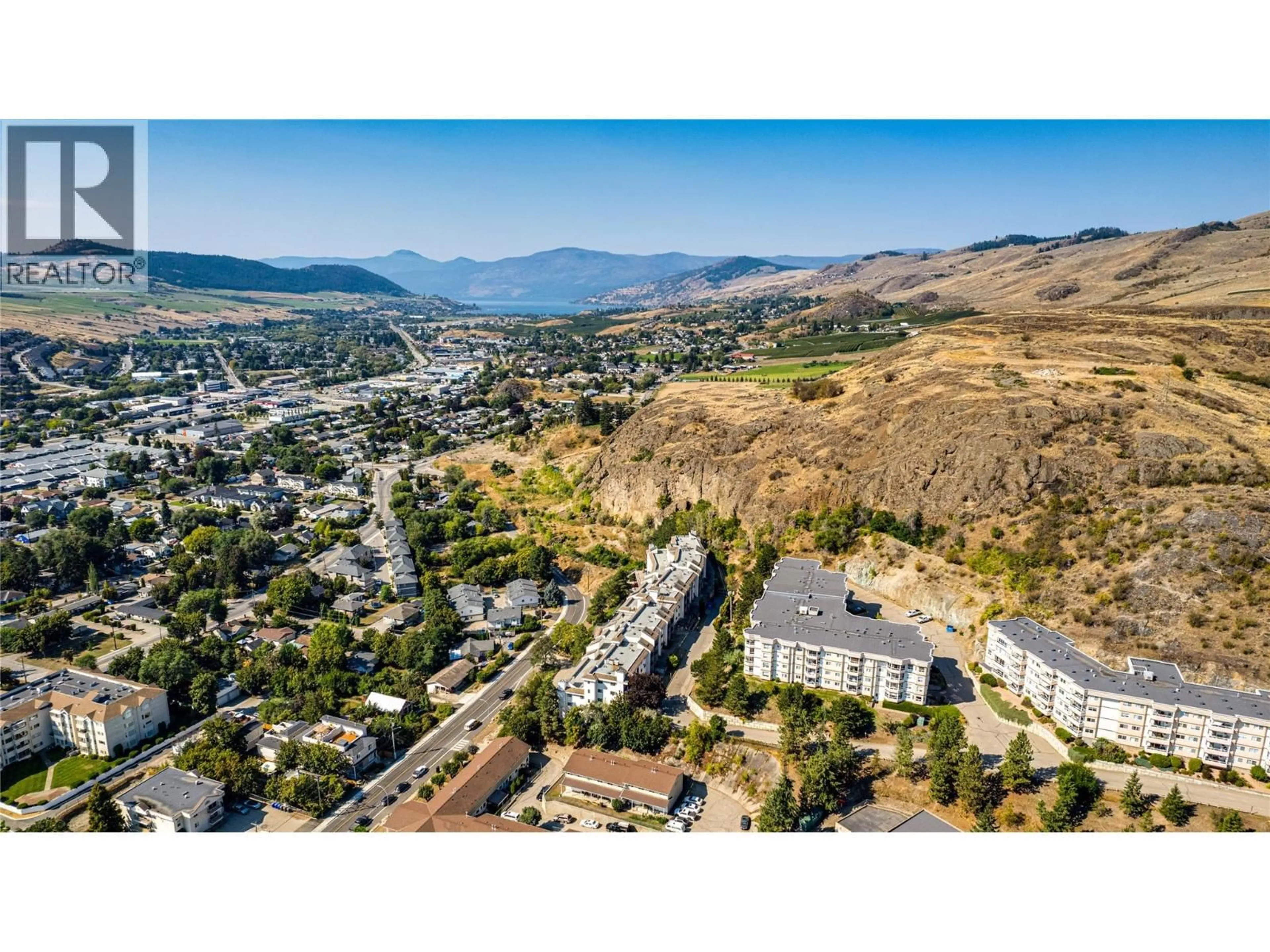 A pic from outside/outdoor area/front of a property/back of a property/a pic from drone, mountain view for 208 - 3901 32 AVENUE, Vernon British Columbia V1T8M3