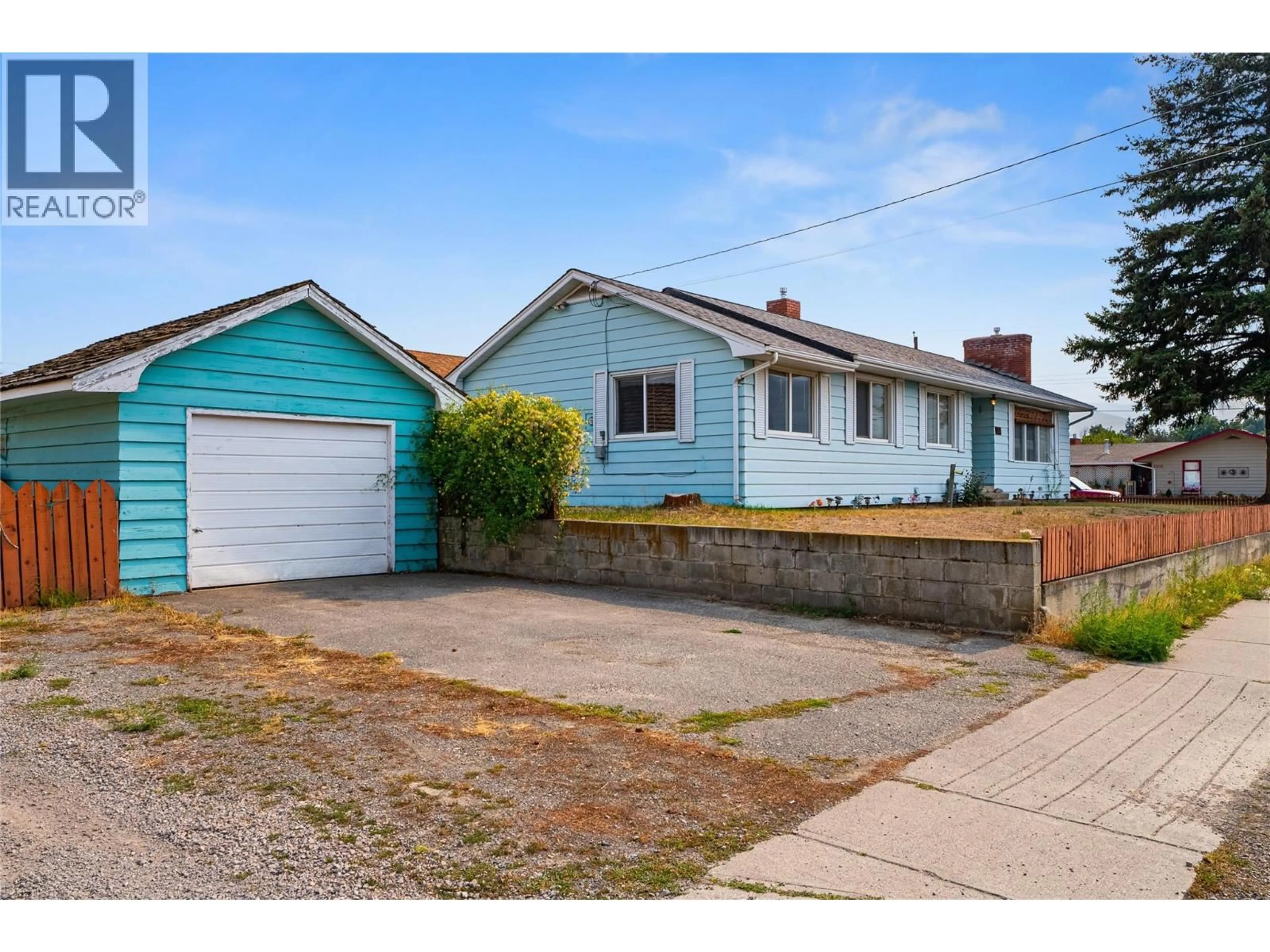 Home with vinyl exterior material, street for 1552 GARCIA STREET, Merritt British Columbia V1K1B8