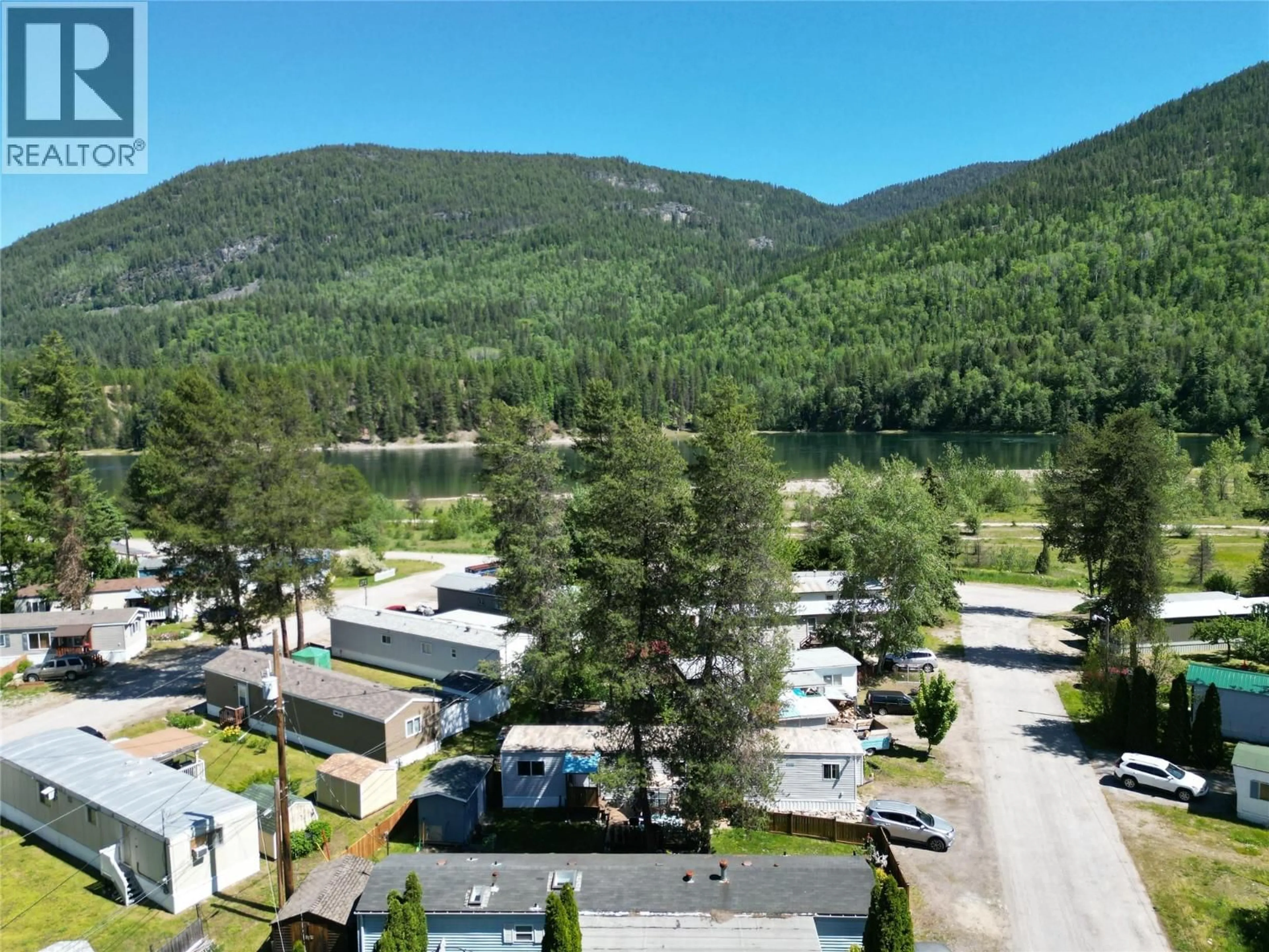 A pic from outside/outdoor area/front of a property/back of a property/a pic from drone, mountain view for 13 - 500 16TH AVENUE, Genelle British Columbia V0G1G0