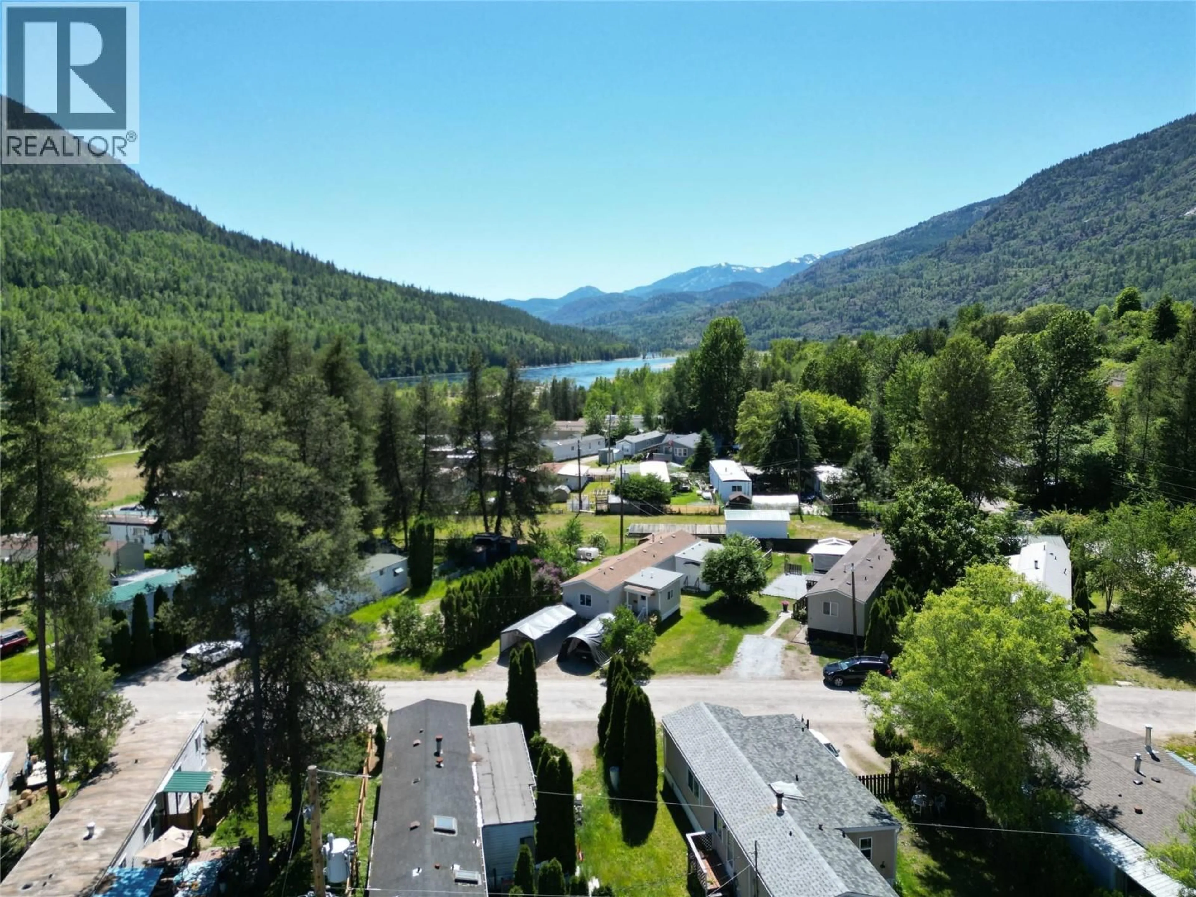 A pic from outside/outdoor area/front of a property/back of a property/a pic from drone, mountain view for 13 - 500 16TH AVENUE, Genelle British Columbia V0G1G0