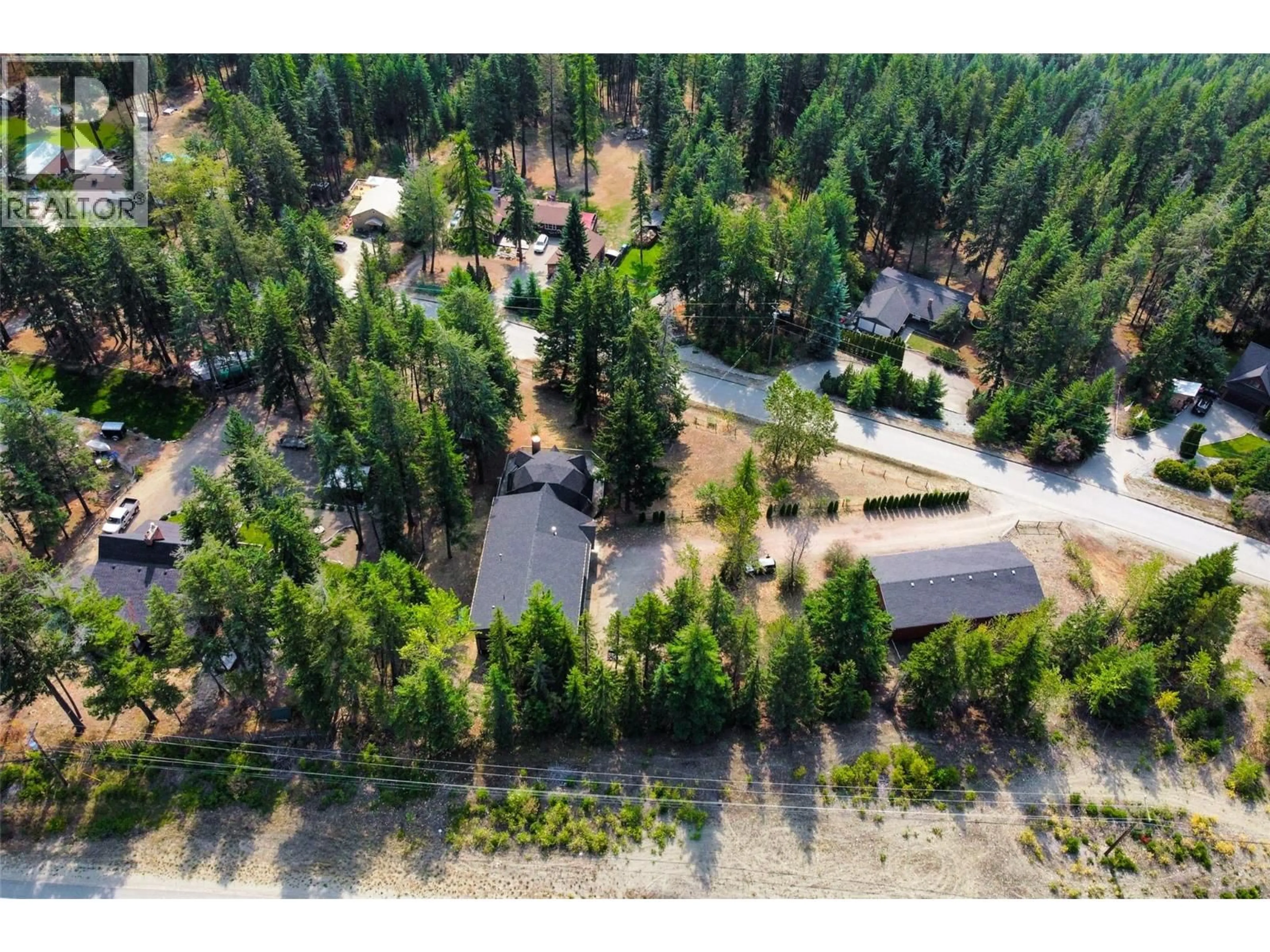 A pic from outside/outdoor area/front of a property/back of a property/a pic from drone, forest/trees view for 7604 FALCON RIDGE CRESCENT, Kelowna British Columbia V1P1J1