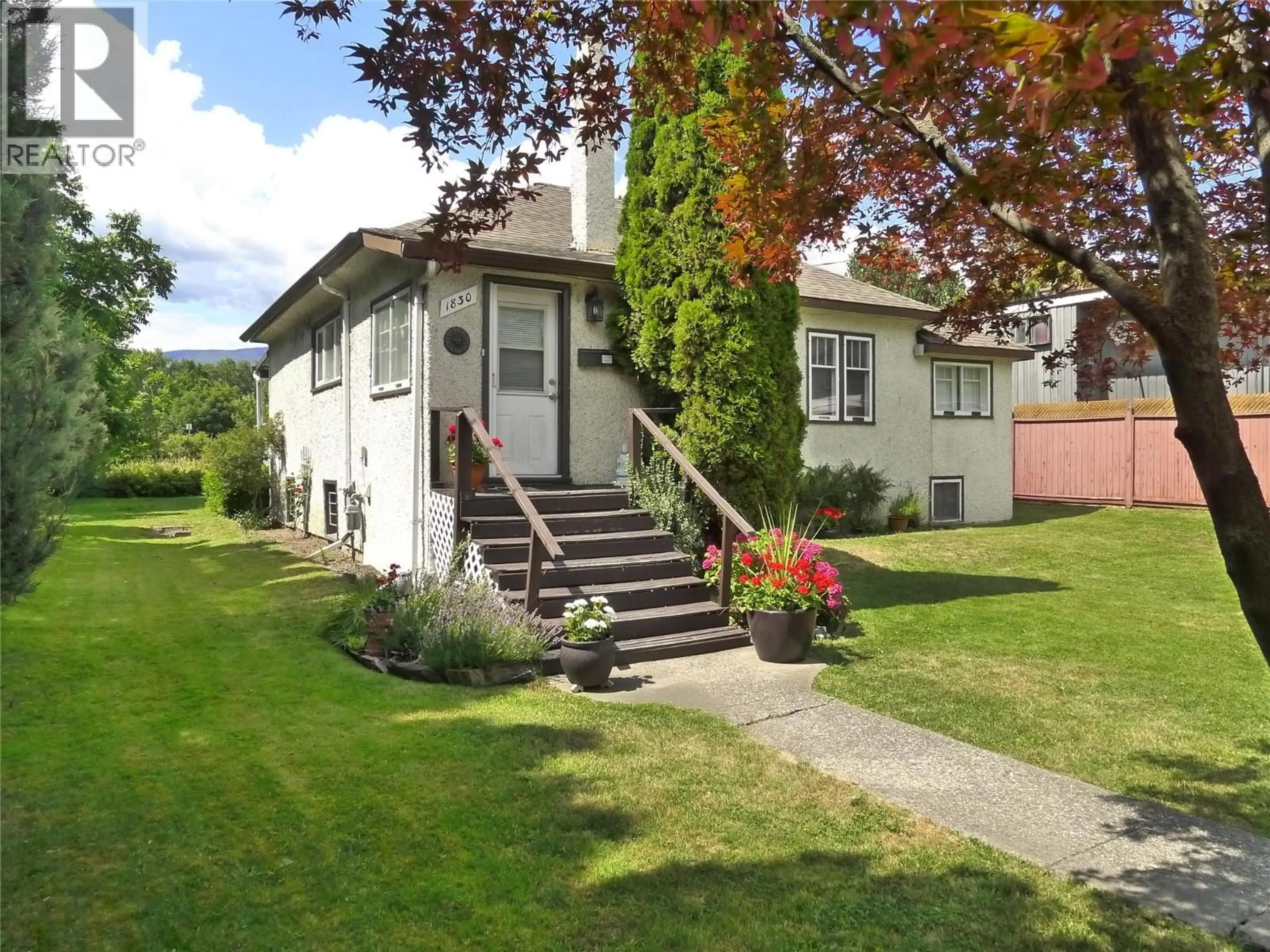 Home with vinyl exterior material, street for 1830 RIVERSIDE AVENUE, Kelowna British Columbia V1Y1A7