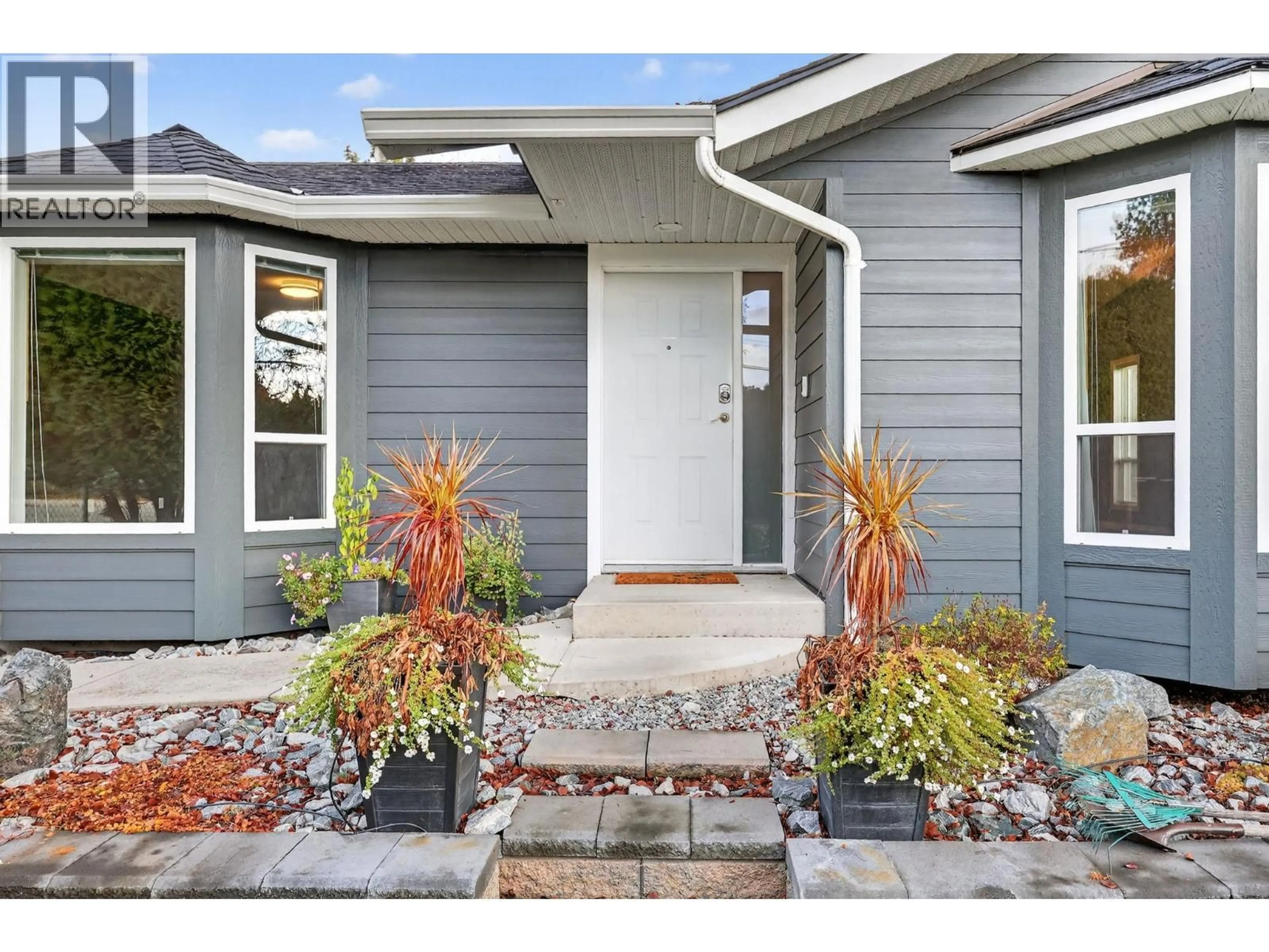 Home with vinyl exterior material, street for 3319 GROUSE ROAD, West Kelowna British Columbia V4T2H2