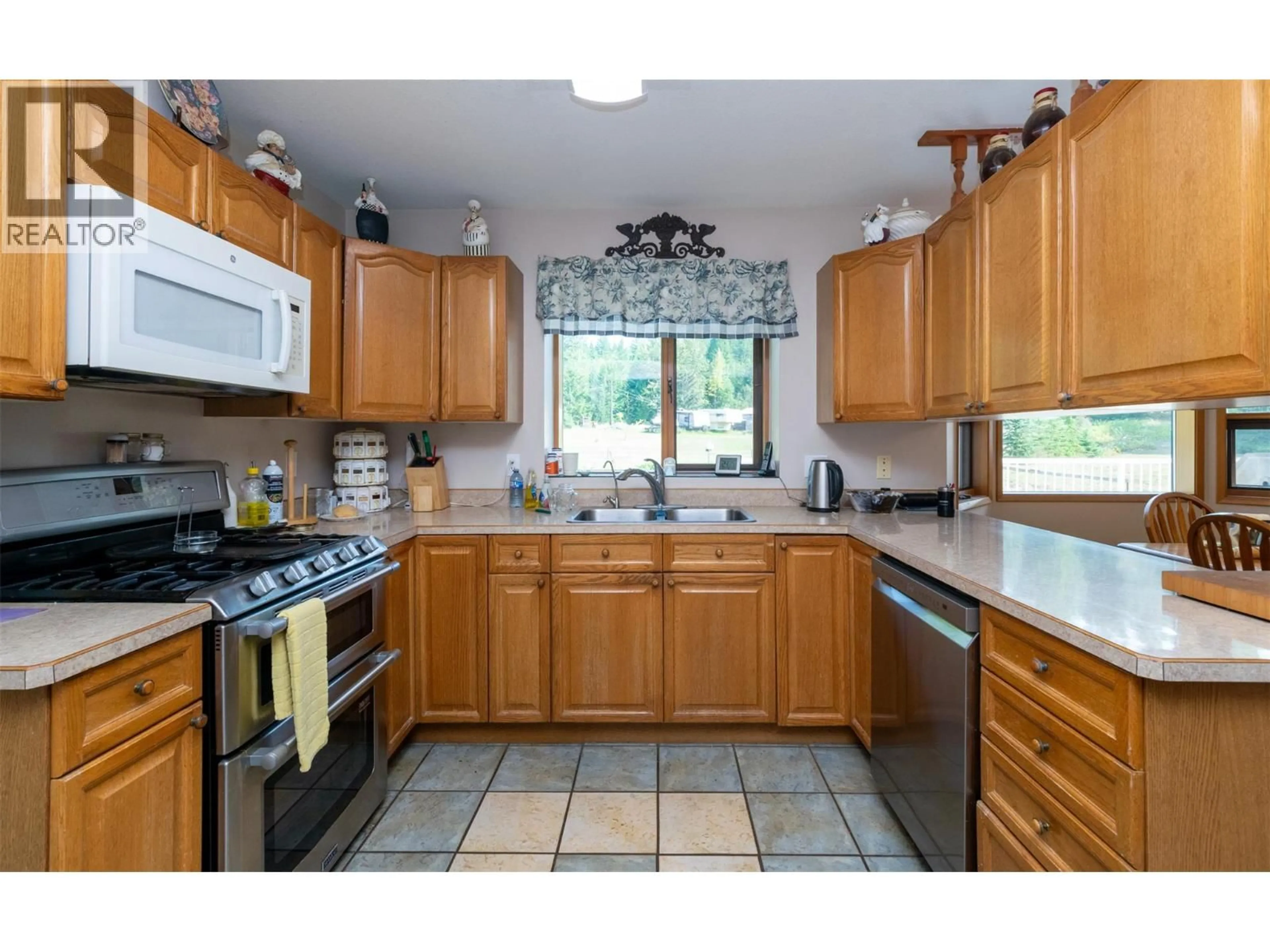 Standard kitchen, ceramic/tile floor for 102 KAULT HILL ROAD, Salmon Arm British Columbia V1E3A3