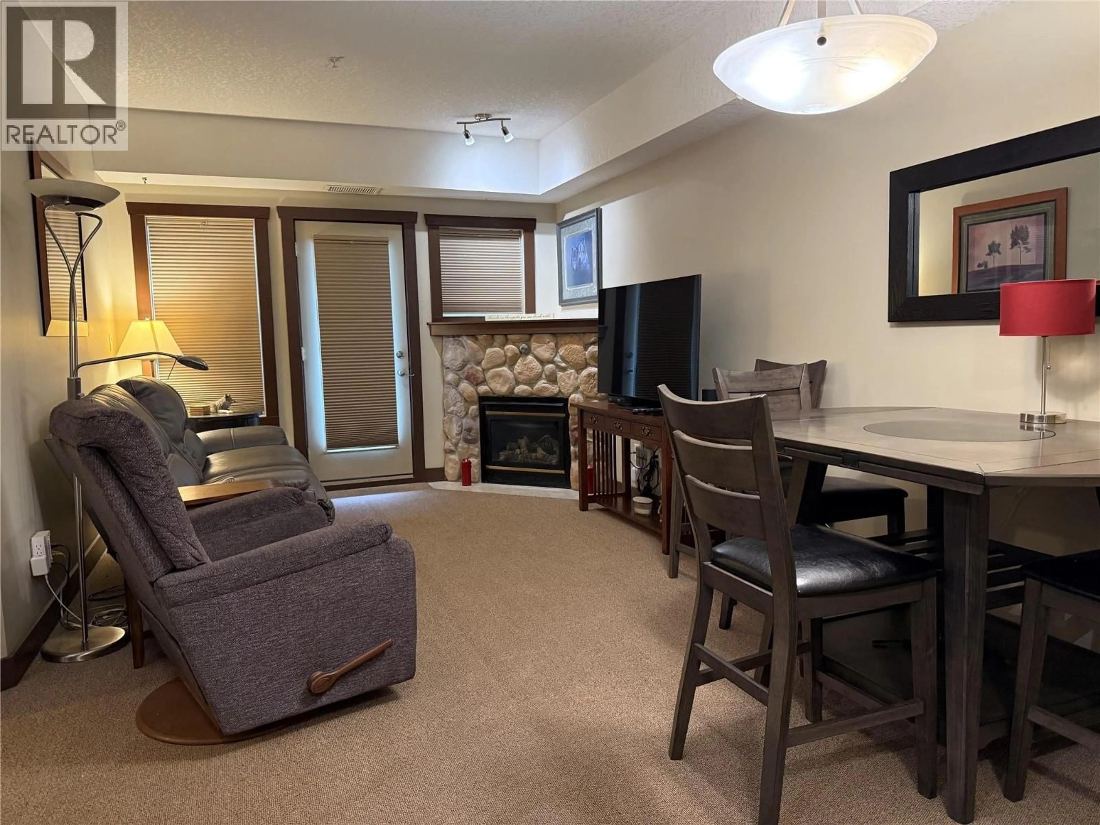 Living room with furniture, wood/laminate floor for 203 - 1500 MCDONALD AVENUE, Fernie British Columbia V0B1M1