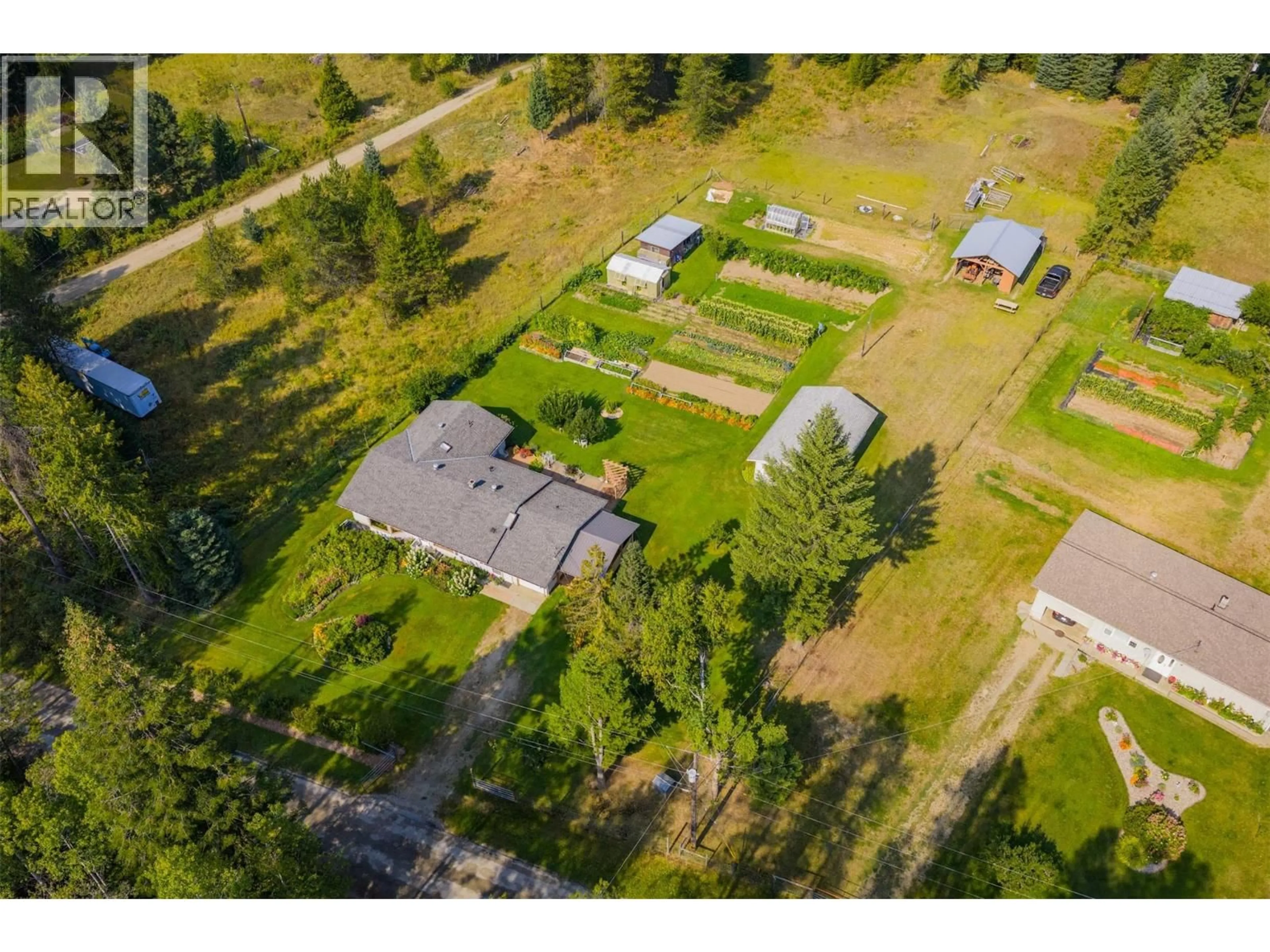 A pic from outside/outdoor area/front of a property/back of a property/a pic from drone, street for 3712 THORPE ROAD, Krestova British Columbia V0G1H2