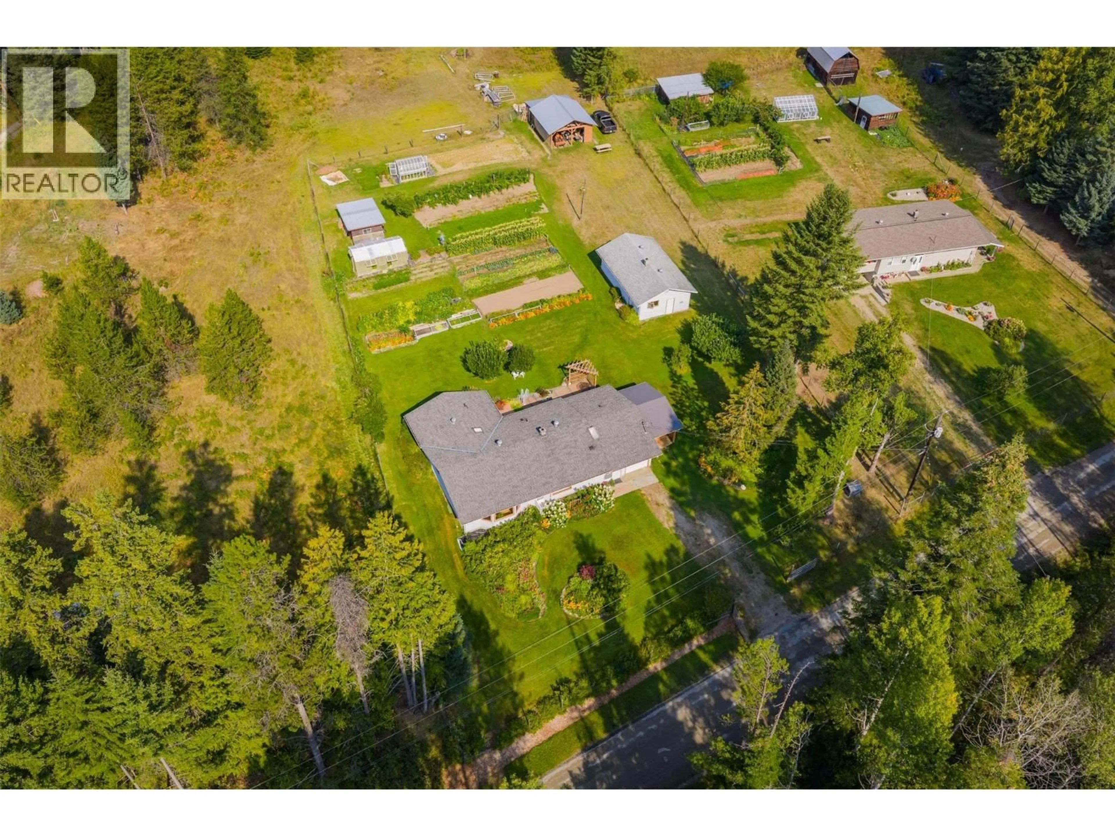 A pic from outside/outdoor area/front of a property/back of a property/a pic from drone, street for 3712 THORPE ROAD, Krestova British Columbia V0G1H2