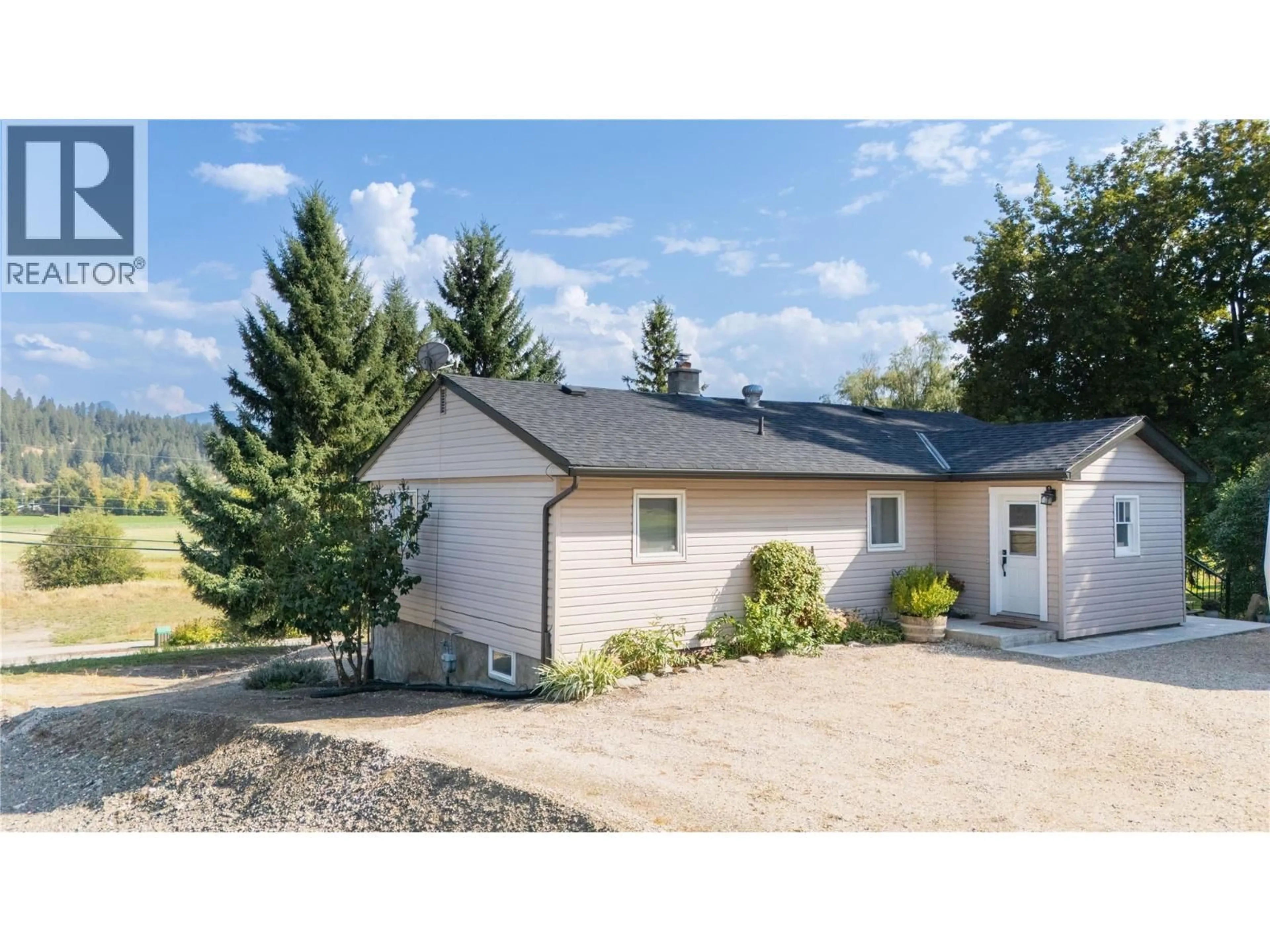 Home with vinyl exterior material, street for 2506 SHUSWAP AVENUE, Lumby British Columbia V0E2G0