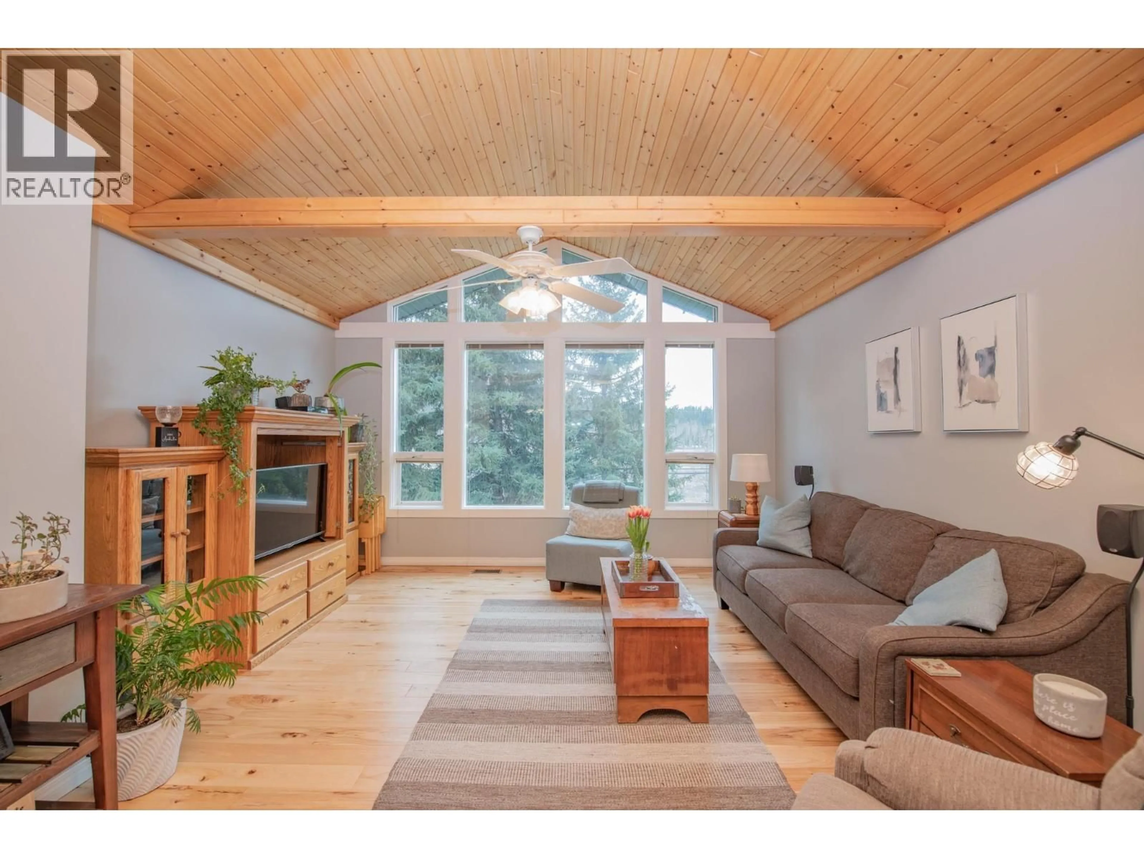 Living room with furniture, wood/laminate floor for 2506 SHUSWAP AVENUE, Lumby British Columbia V0E2G0