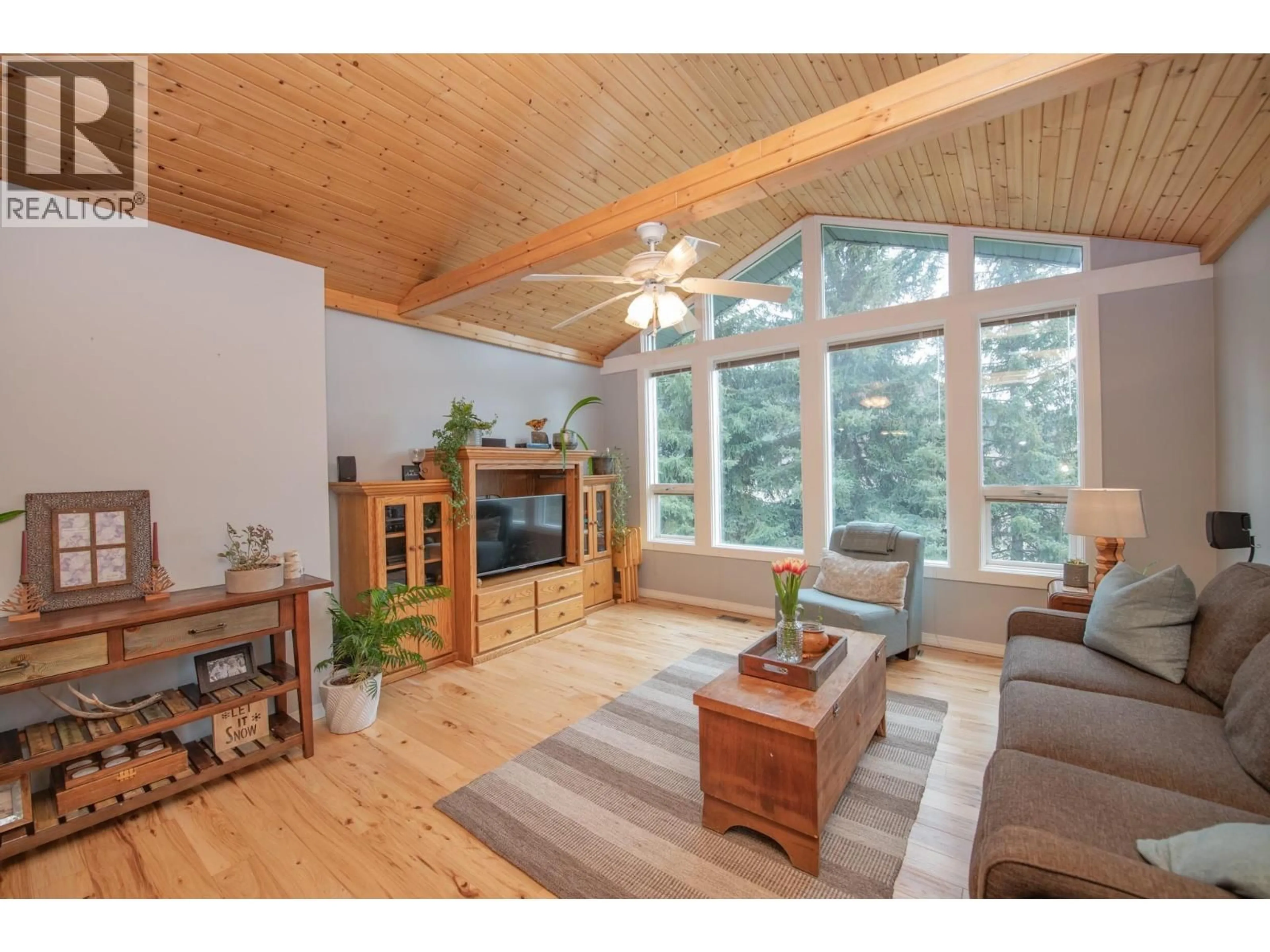 Living room with furniture, wood/laminate floor for 2506 SHUSWAP AVENUE, Lumby British Columbia V0E2G0