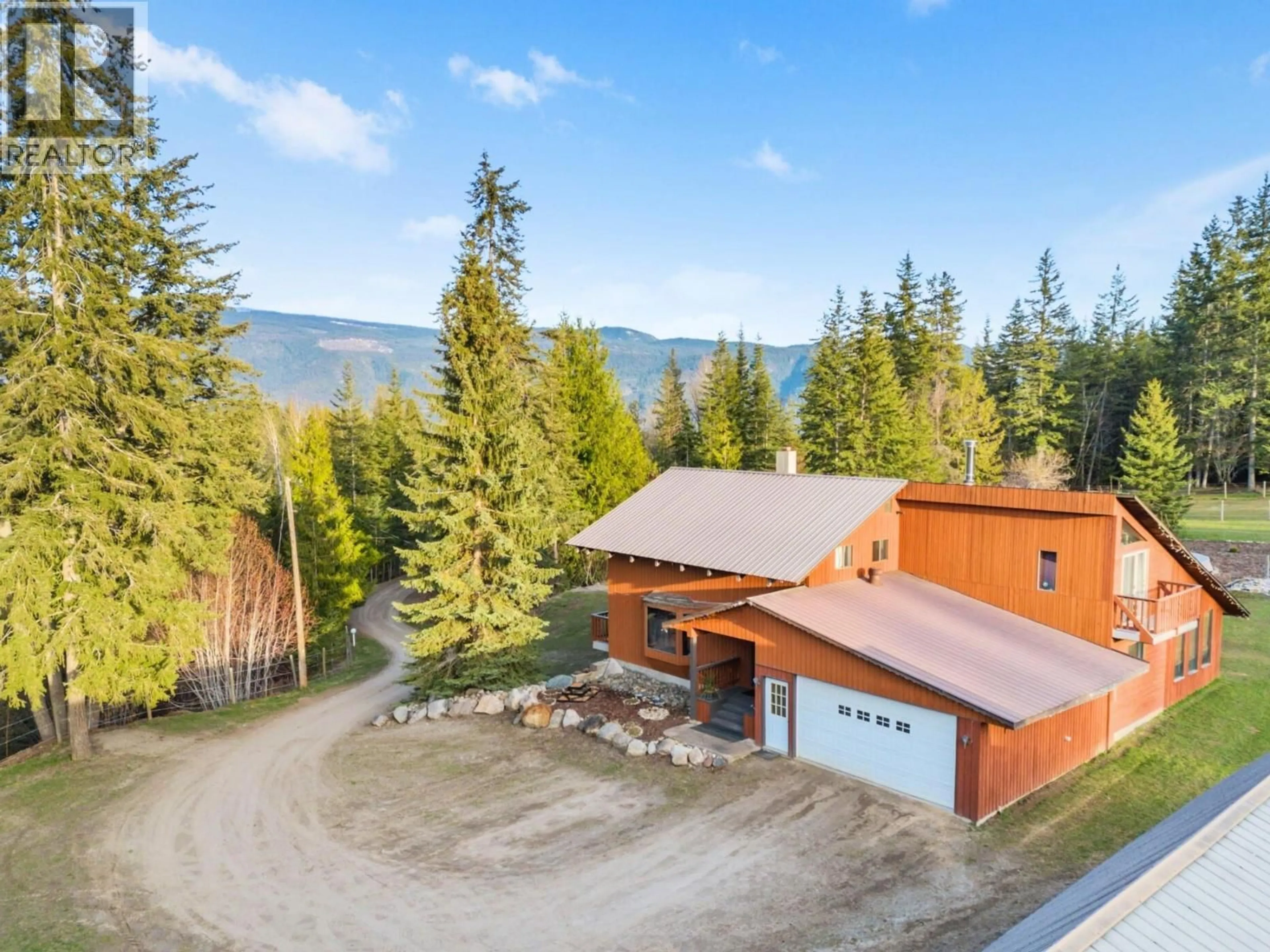 A pic from outside/outdoor area/front of a property/back of a property/a pic from drone, mountain view for 198 EDGAR ROAD, Salmon Arm British Columbia V1E2Y2