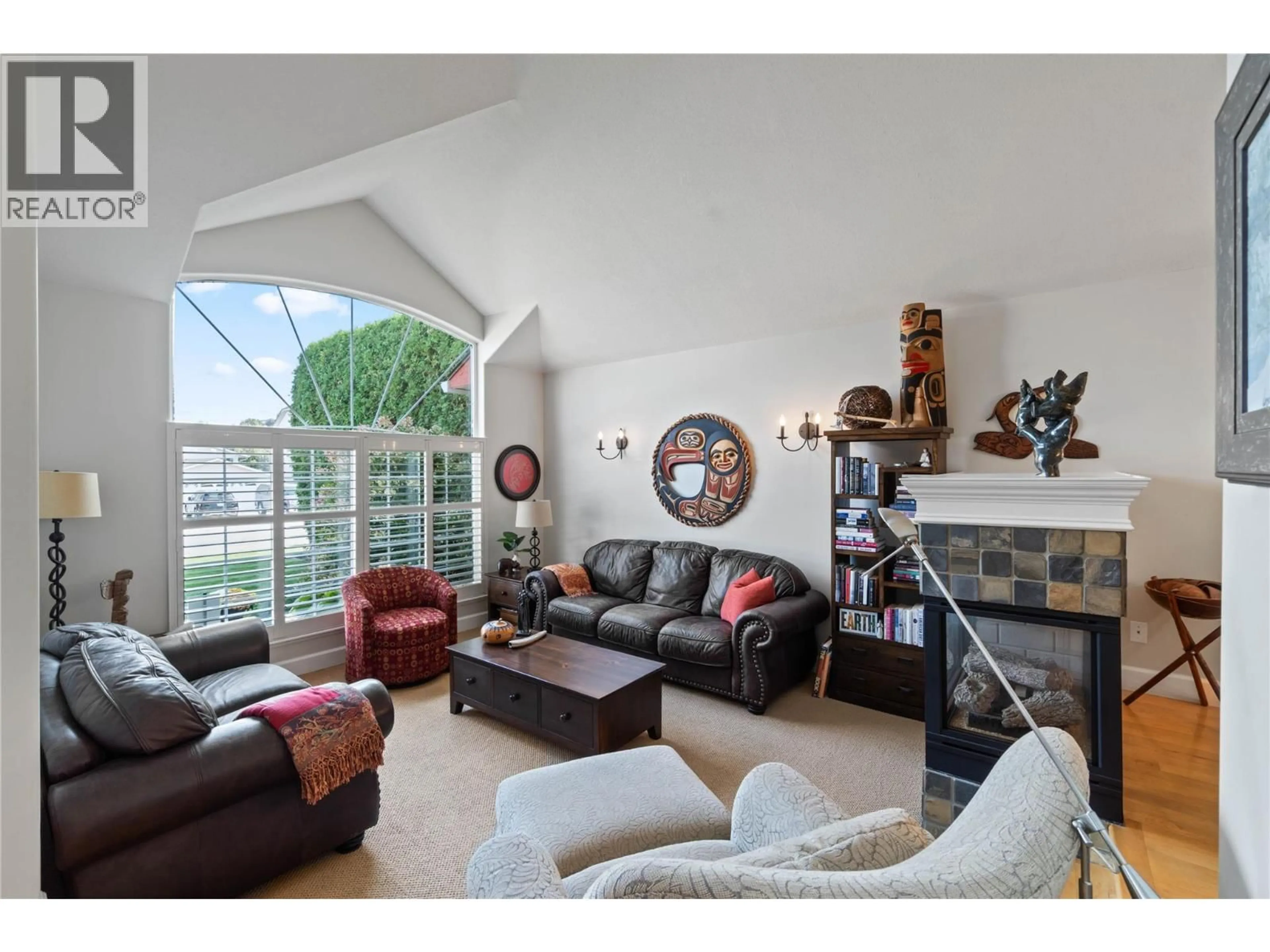 Living room with furniture, wood/laminate floor for 2068 TANTALUS COURT, Kamloops British Columbia V2E2L4