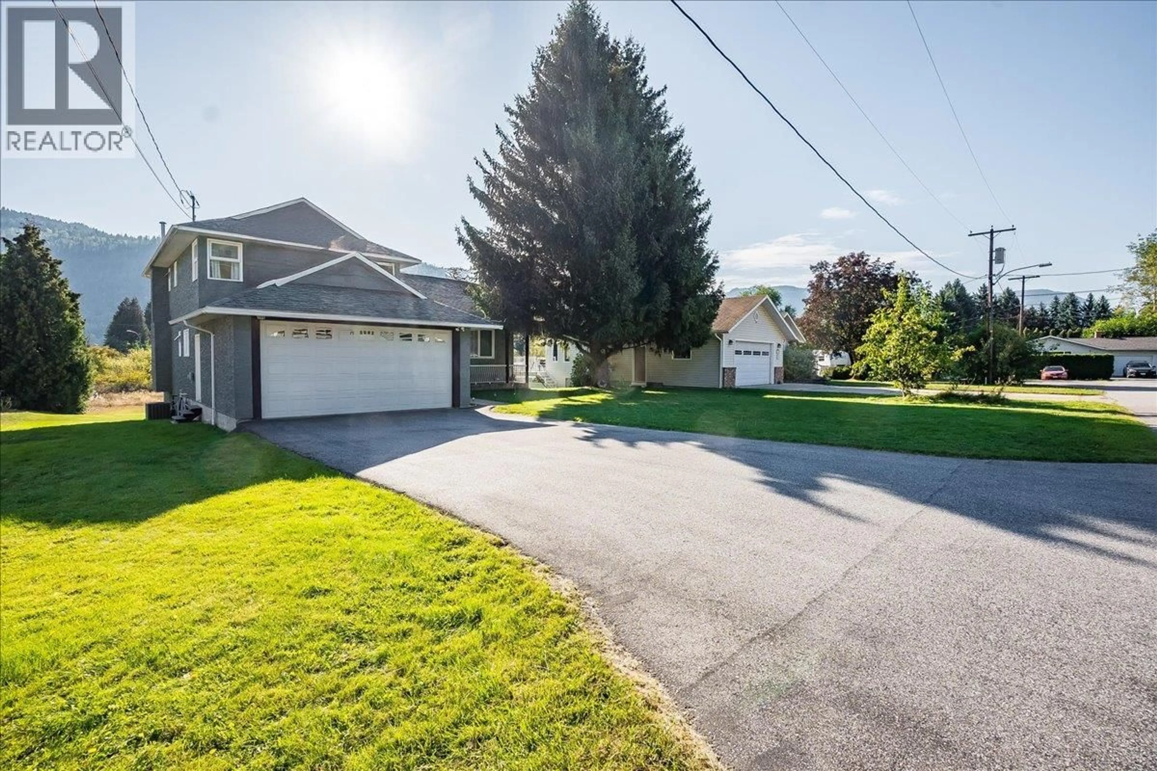 A pic from outside/outdoor area/front of a property/back of a property/a pic from drone, street for 408 BERESFORD CRESCENT, Castlegar British Columbia V1N3V5