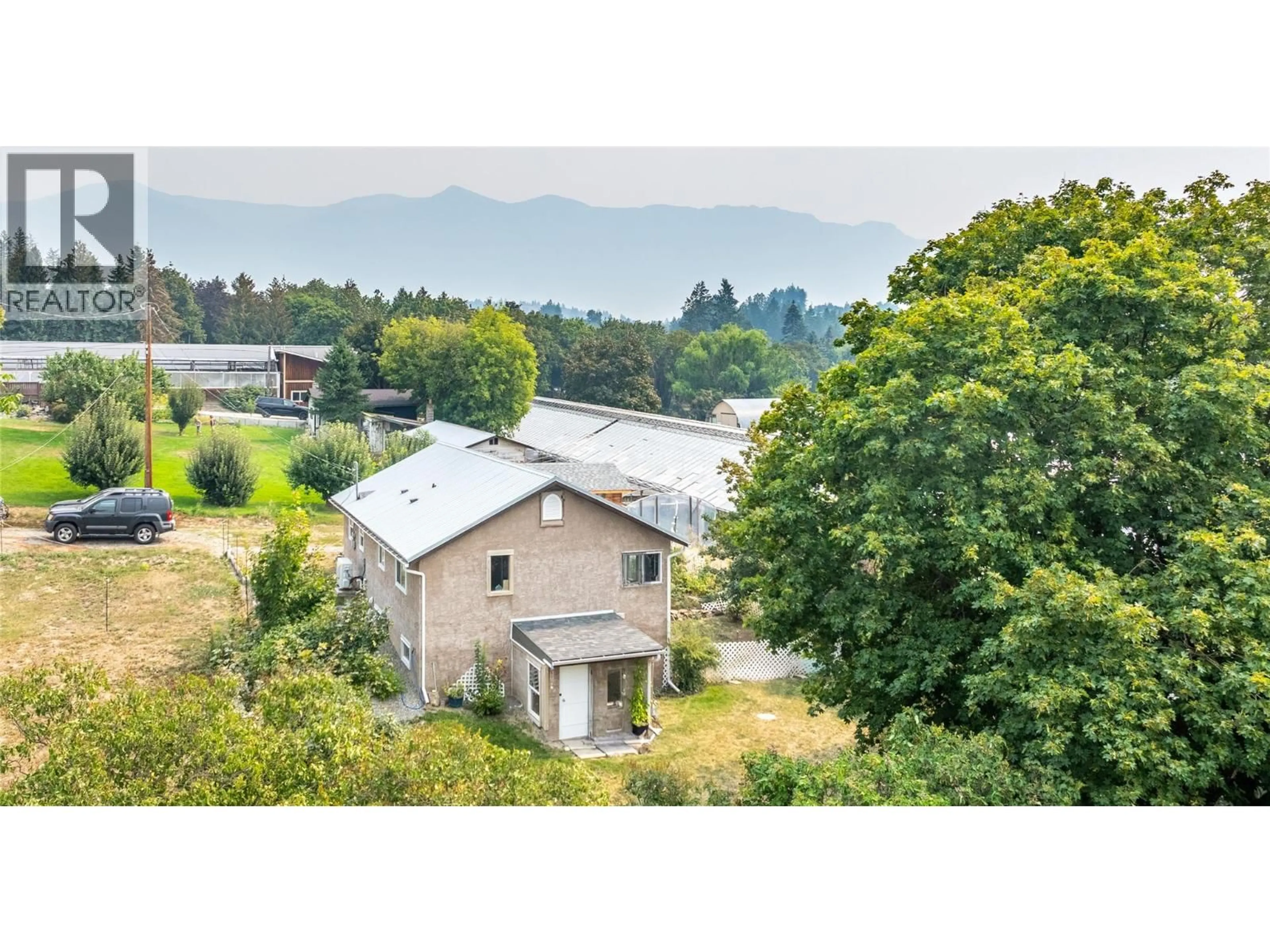 A pic from outside/outdoor area/front of a property/back of a property/a pic from drone, mountain view for 1215 ERICKSON ROAD, Creston British Columbia V0B1G3