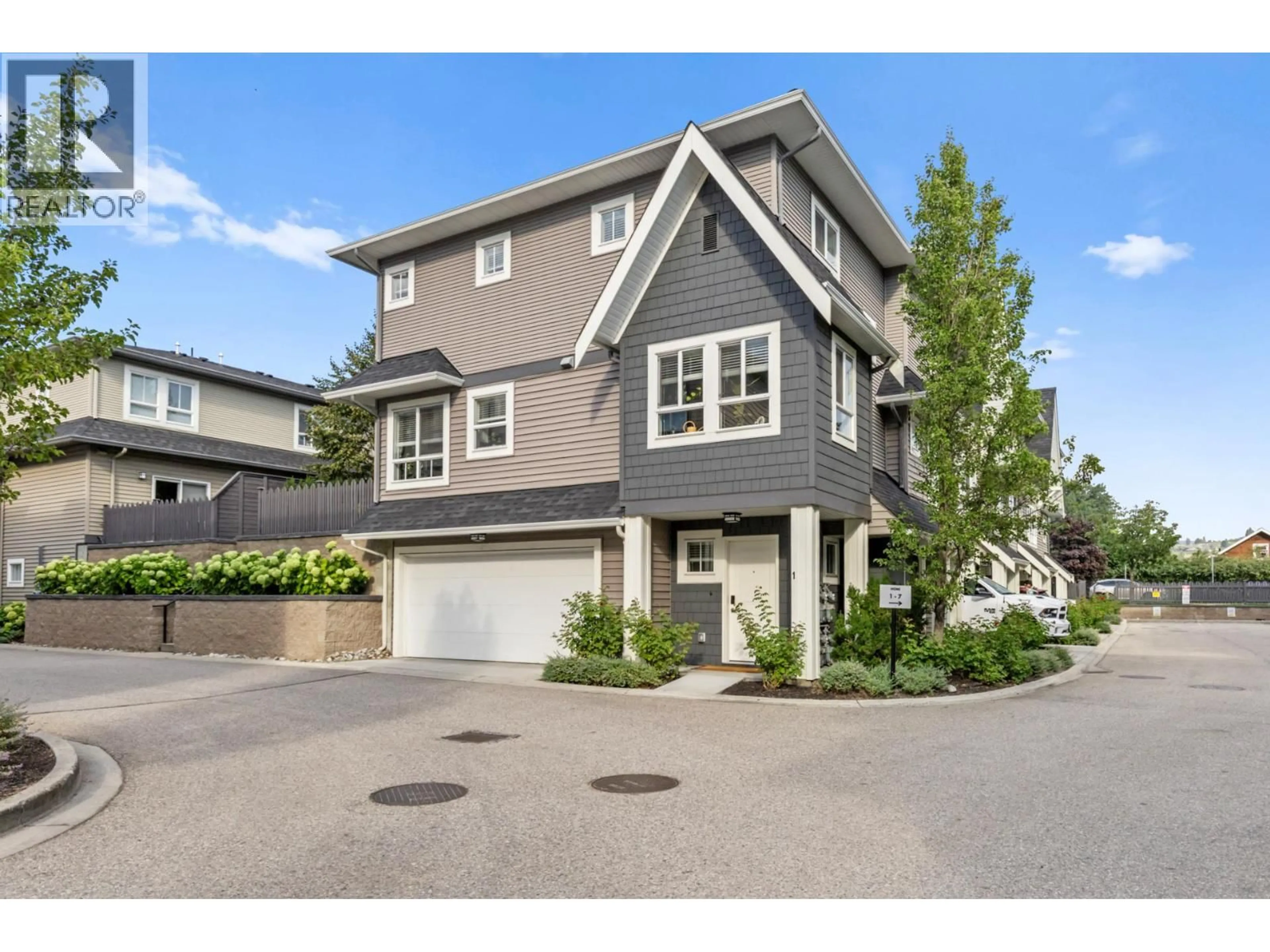 Home with vinyl exterior material, street for 1 - 680 OLD MEADOWS ROAD, Kelowna British Columbia V1W5L4