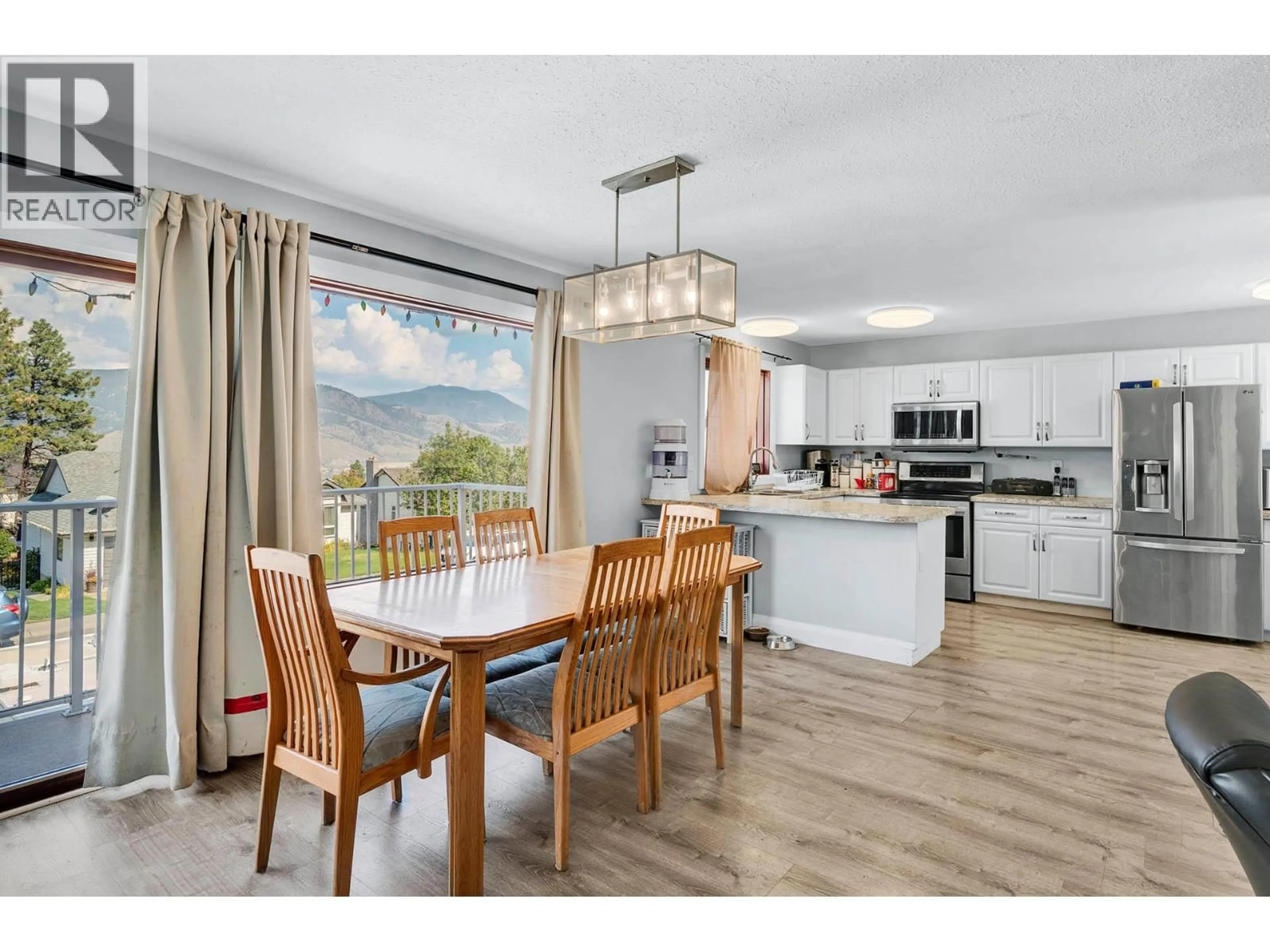 Open concept kitchen, wood/laminate floor for 2727 QU'APPELLE BOULEVARD, Kamloops British Columbia V2E2J9
