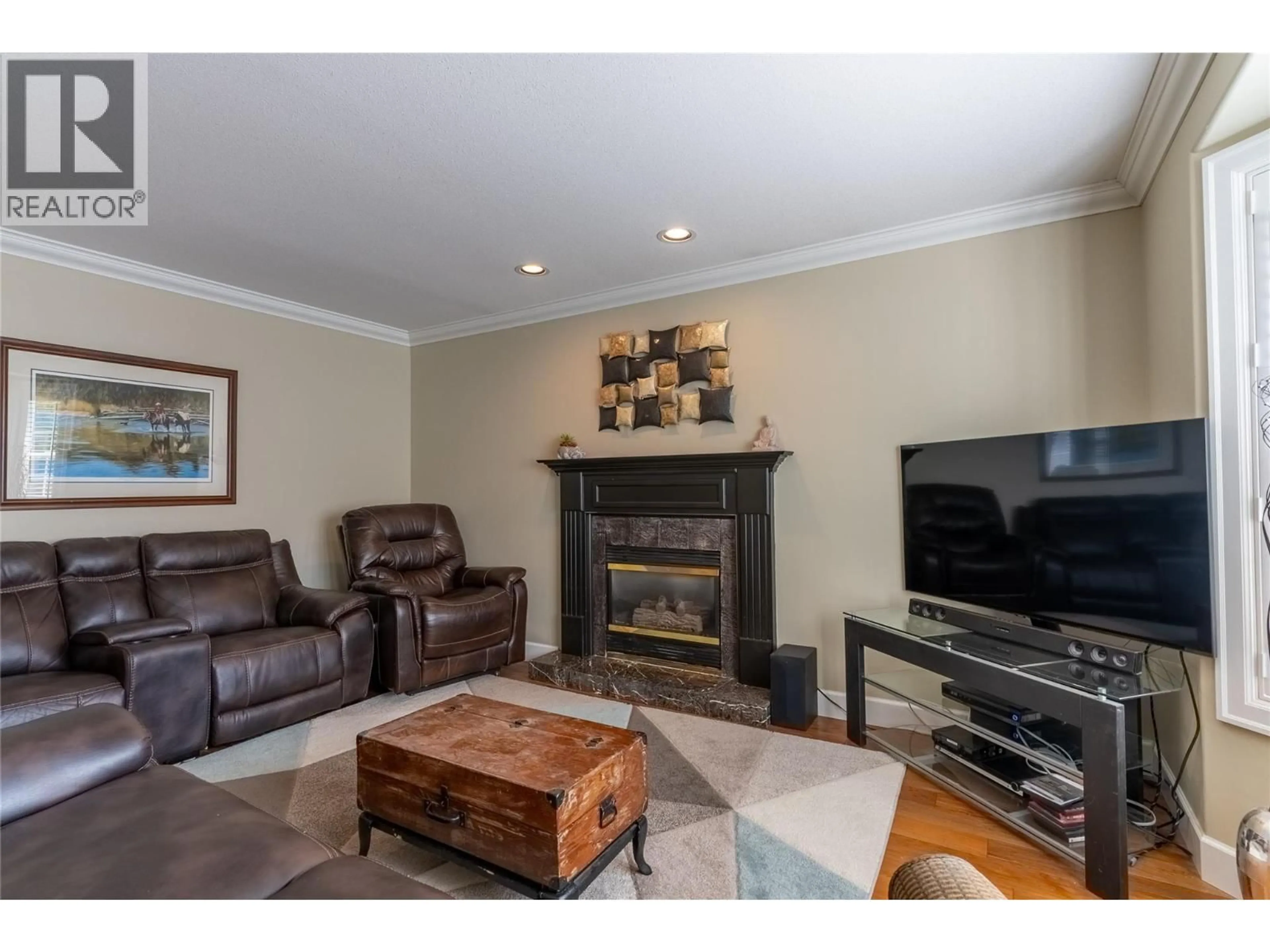 Living room with furniture, wood/laminate floor for 2375 CANONGATE PLACE, Kamloops British Columbia V1S1W8
