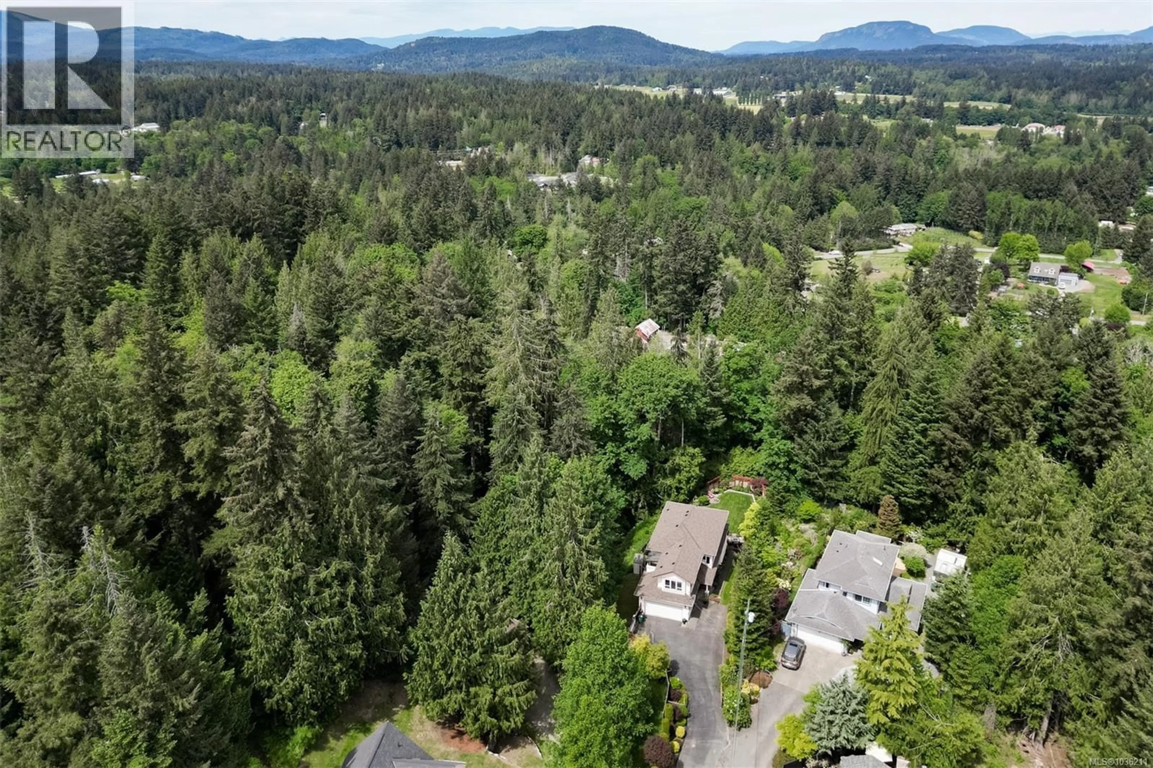 A pic from outside/outdoor area/front of a property/back of a property/a pic from drone, forest/trees view for 1143 FERN RIDGE DRIVE, Mill Bay British Columbia V0R2P2