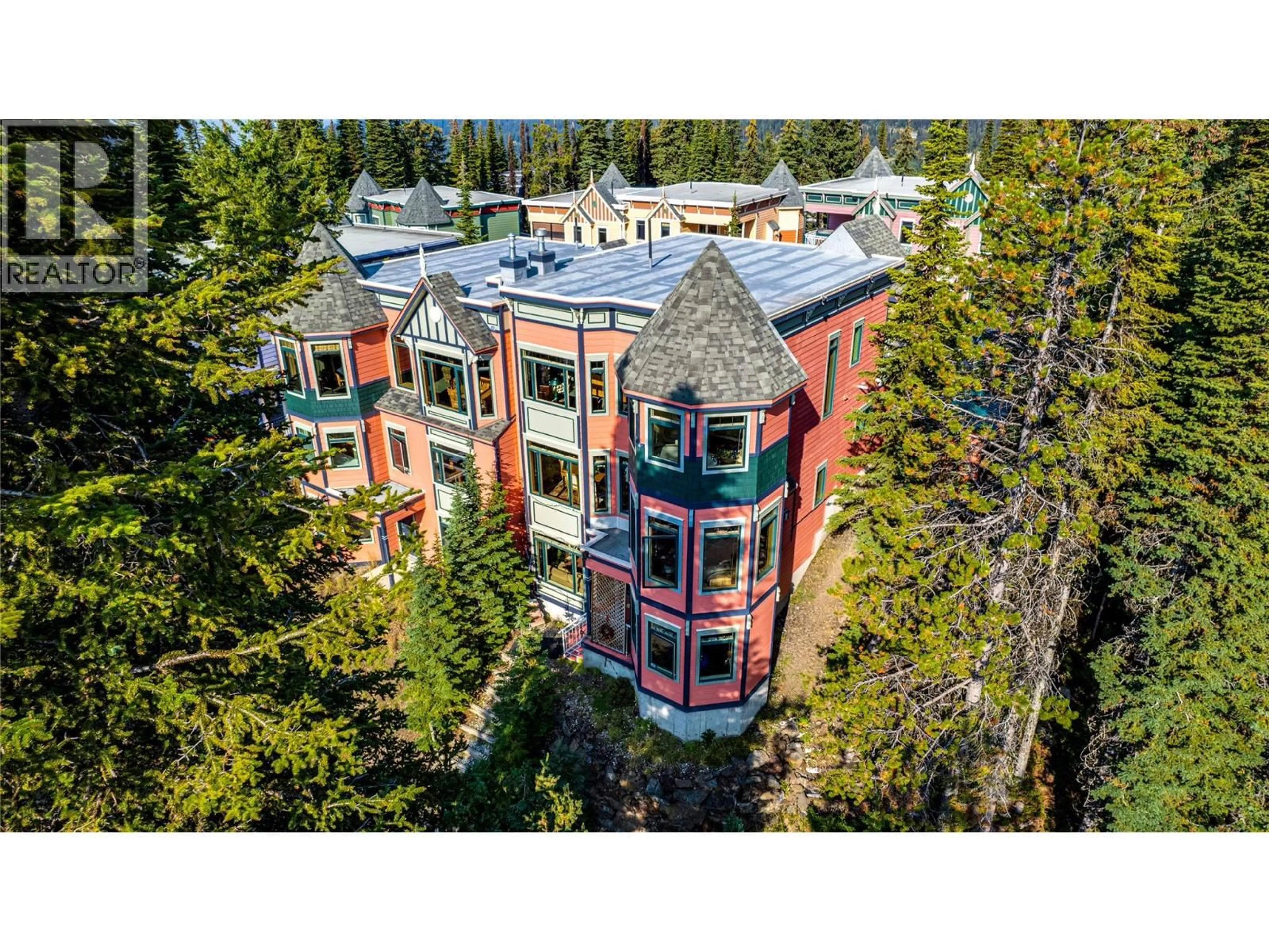 A pic from outside/outdoor area/front of a property/back of a property/a pic from drone, building for 8 - 635 MONASHEE ROAD, Silver Star British Columbia V1B0T1