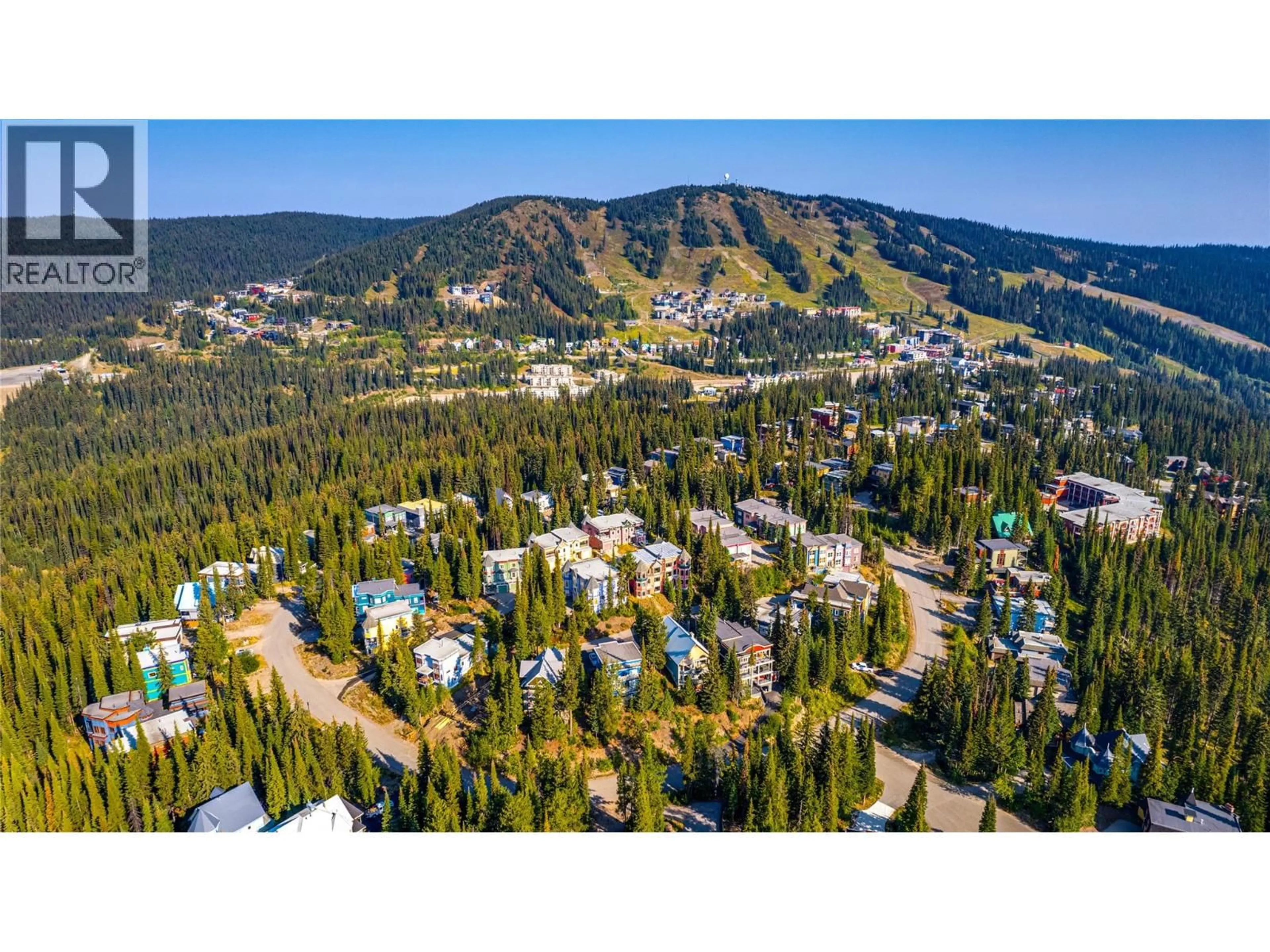 A pic from outside/outdoor area/front of a property/back of a property/a pic from drone, mountain view for 8 - 635 MONASHEE ROAD, Silver Star British Columbia V1B0T1