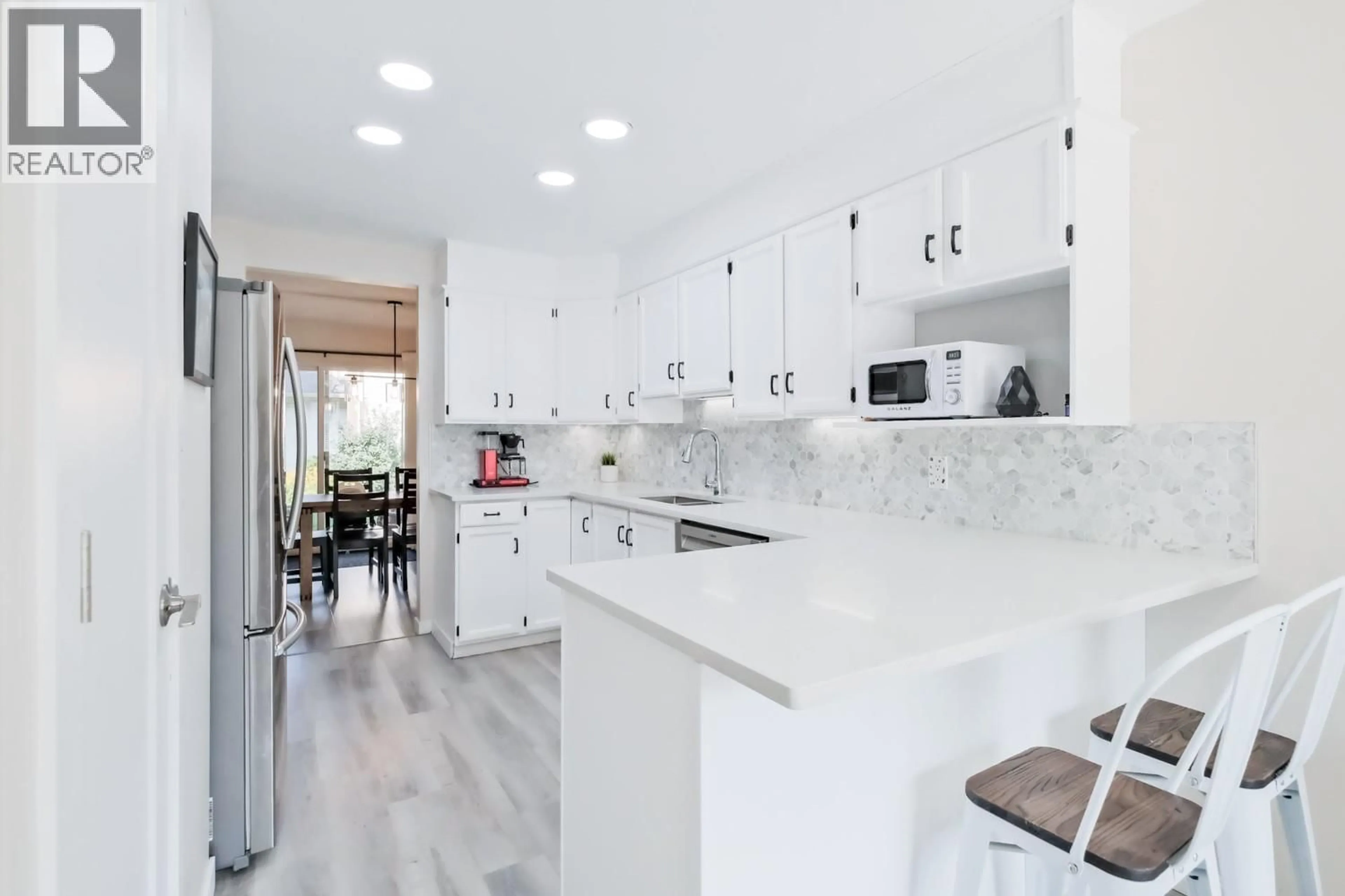 Contemporary kitchen, ceramic/tile floor for 12 - 1853 EDGEHILL AVENUE, Kelowna British Columbia V1V1X8