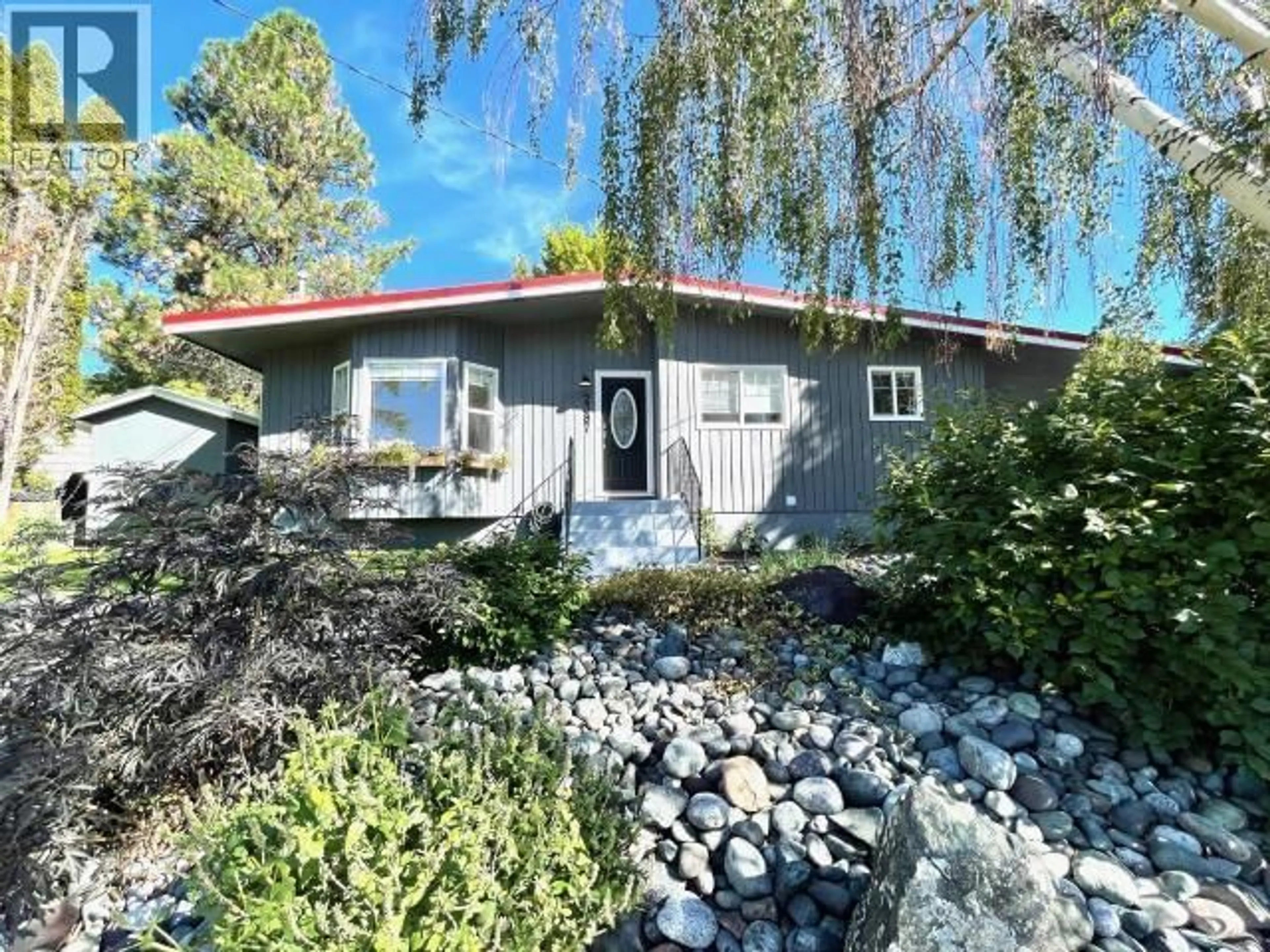 Home with vinyl exterior material, street for 2387 REID AVENUE, Merritt British Columbia V1K1H6
