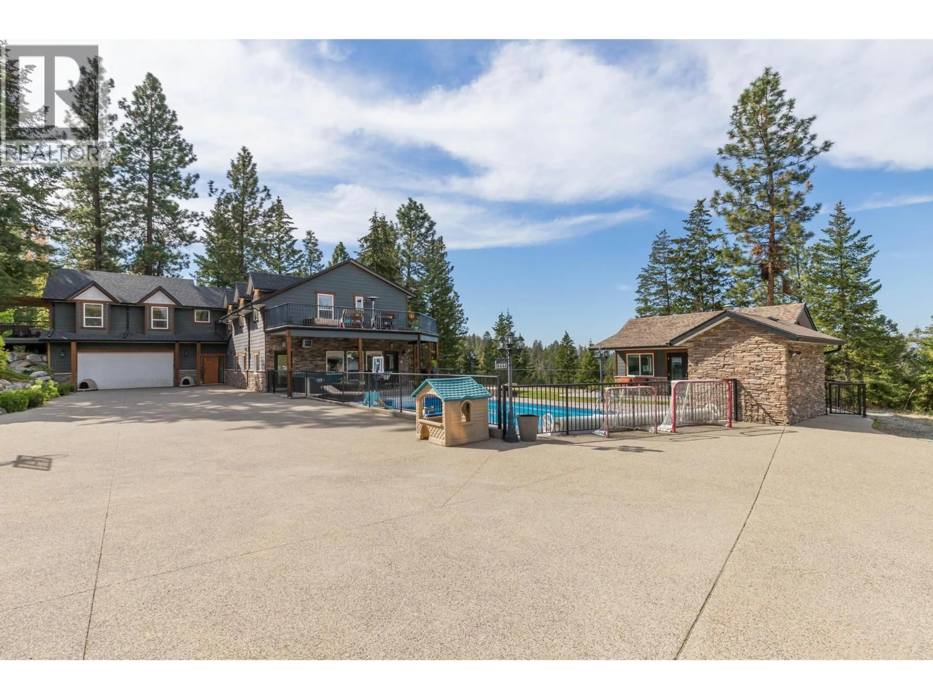 A pic from outside/outdoor area/front of a property/back of a property/a pic from drone, water/lake/river/ocean view for 4444 JUNE SPRINGS ROAD, Kelowna British Columbia V1W4C8